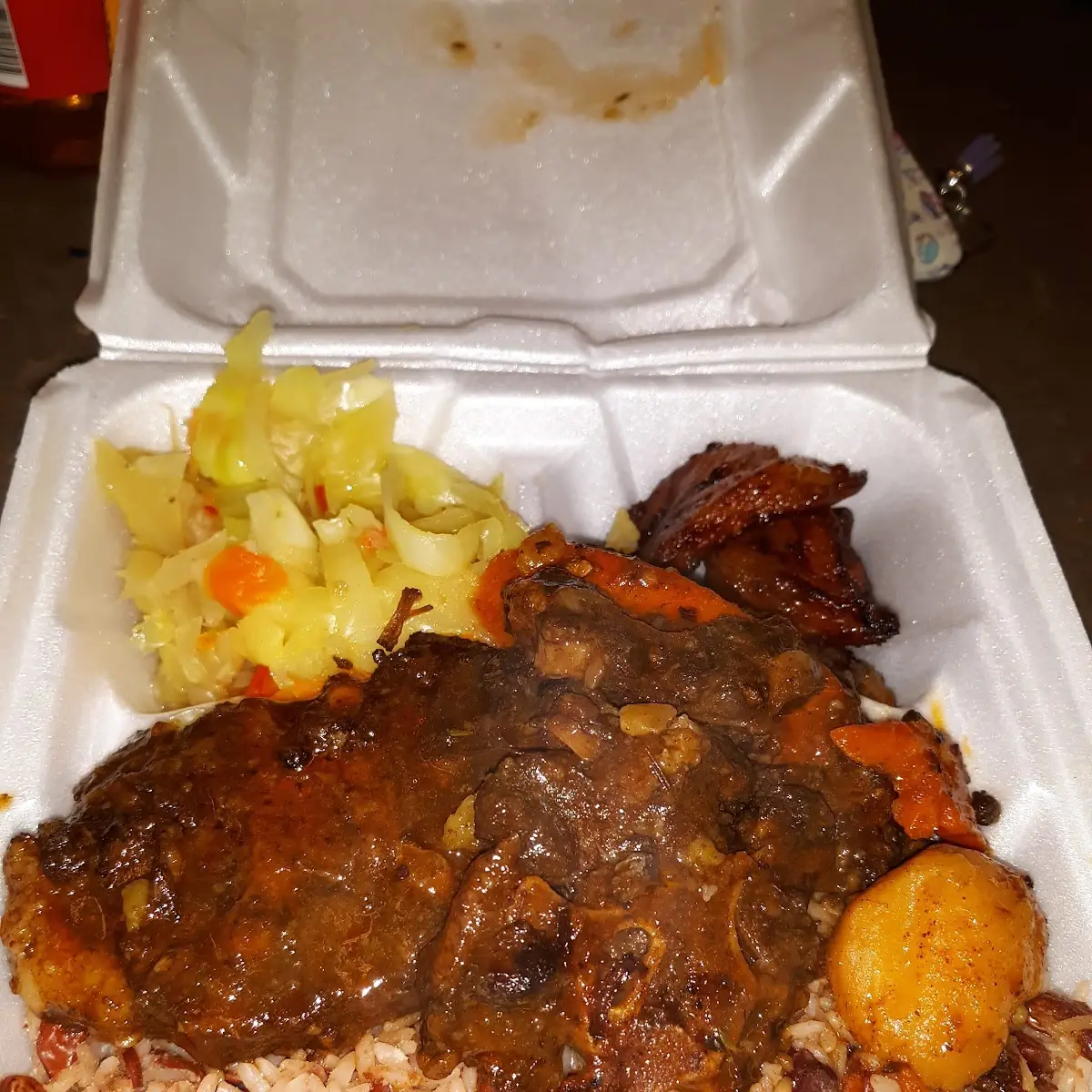 Oxtails Rice & Peas Cabbage & Sweer Plantains