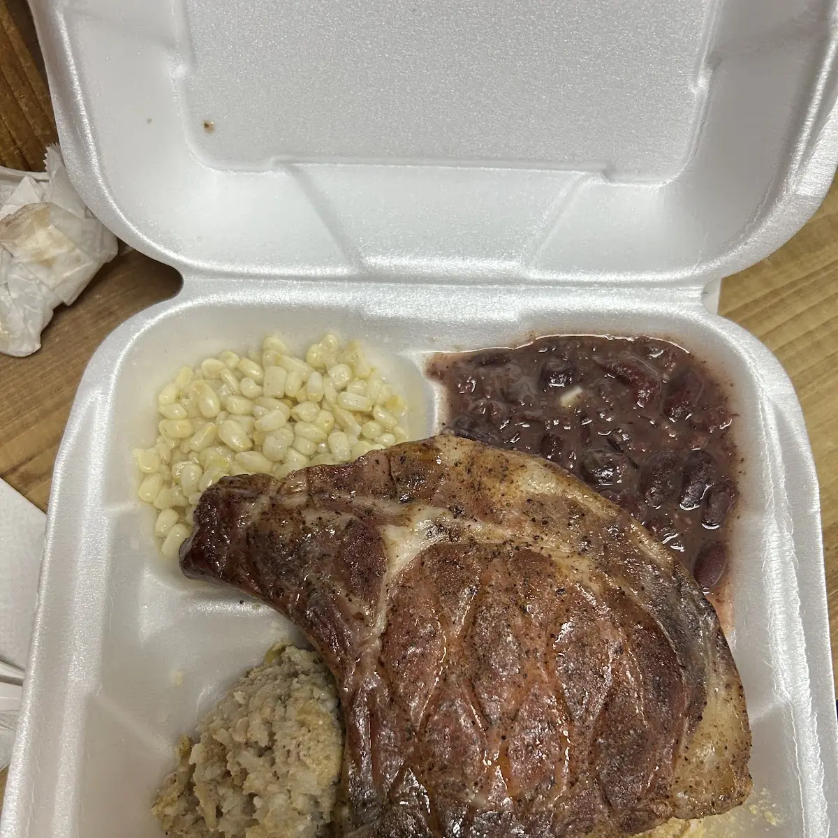 Smoked Pork Chop with Rice Dressing Cornbread Dressing and Two Side Orders