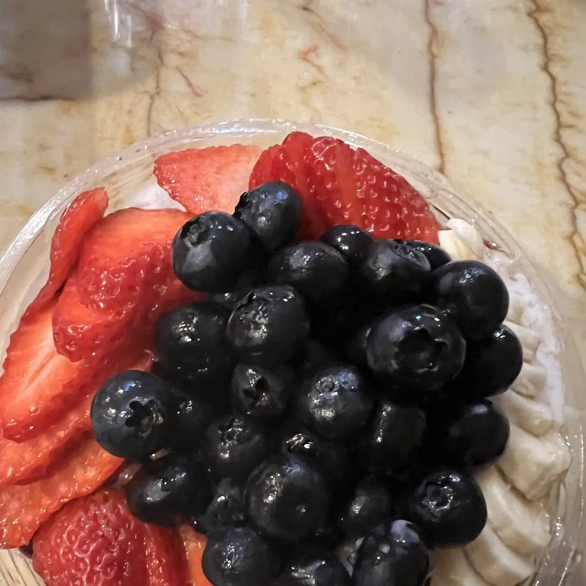 Fruit Bowl with Coconut Nutella Banana Strawberries and Blueberries