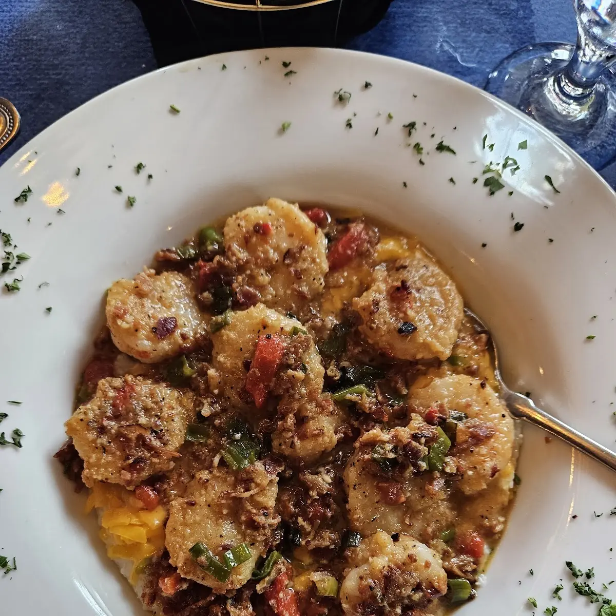 Shrimp Etoufee over Cheese Omelet & Grits