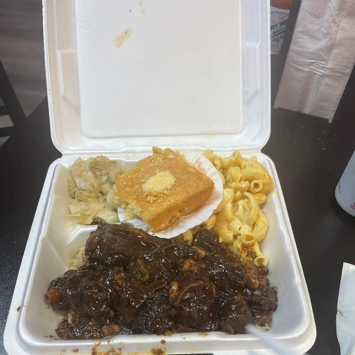 Oxtails with Rice and Beans Cabbage Mac and Cheese Corn Bread