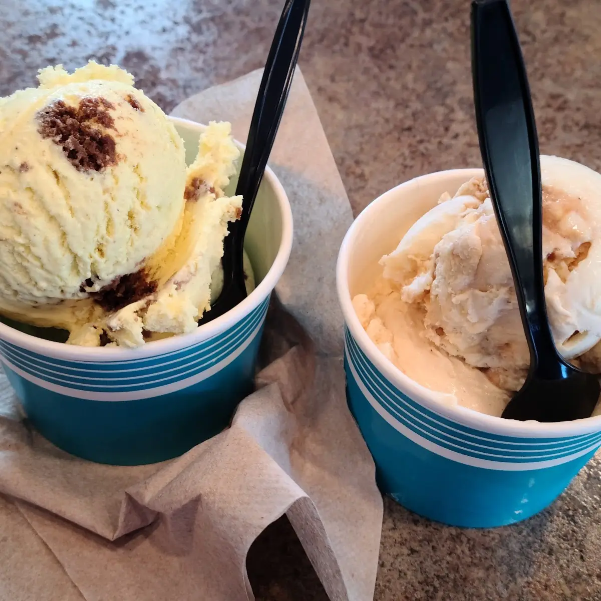 Left Expresso Chip and Ruby Chocolate Ice Creams Right Rhubarb and Lucky Charms Ice Cream Scoops
