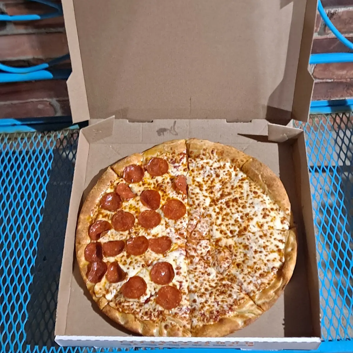 Half Pepperoni Pizza and Half Cheese Pizza with Extra Sauce