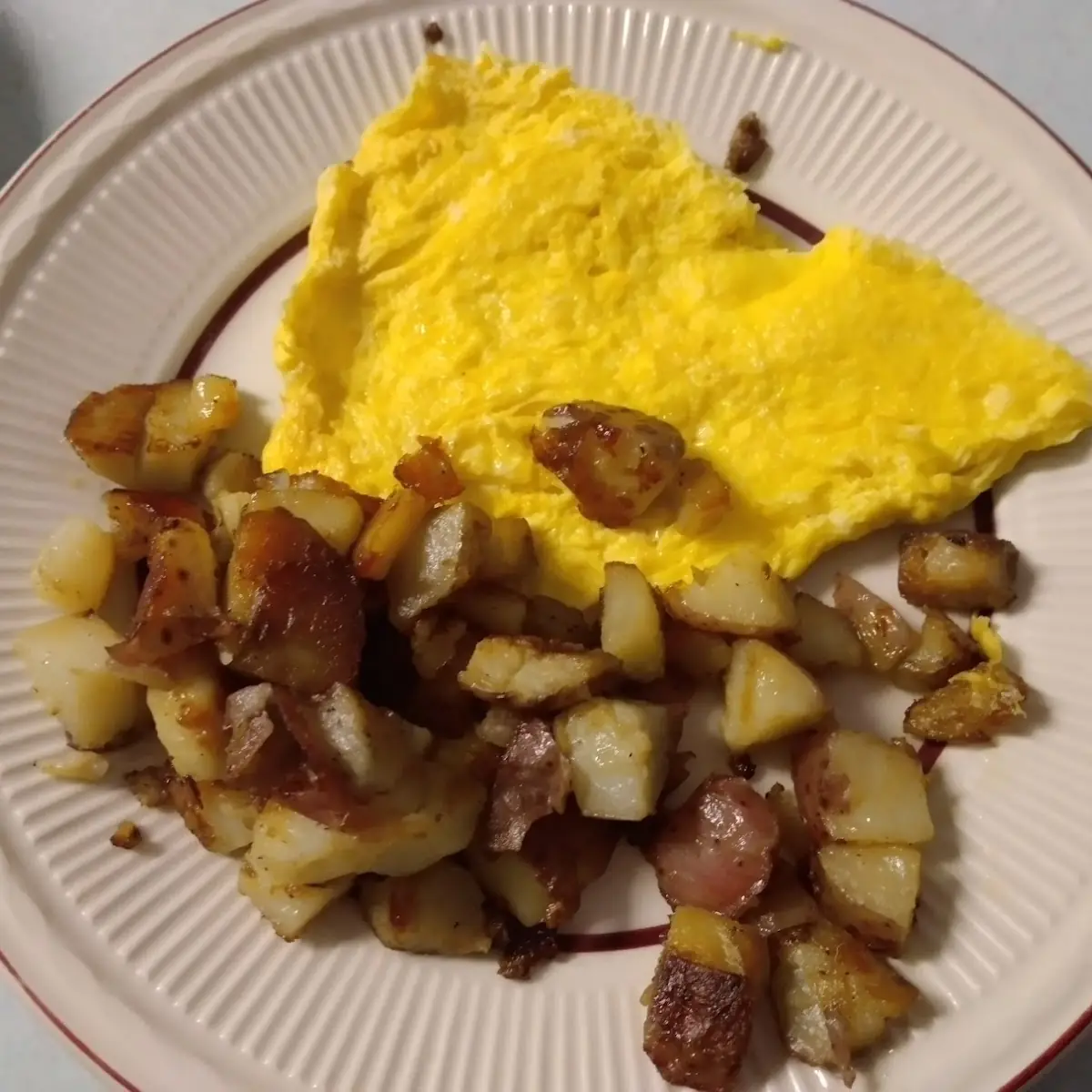 Two Scrambled Eggs and Home Fries