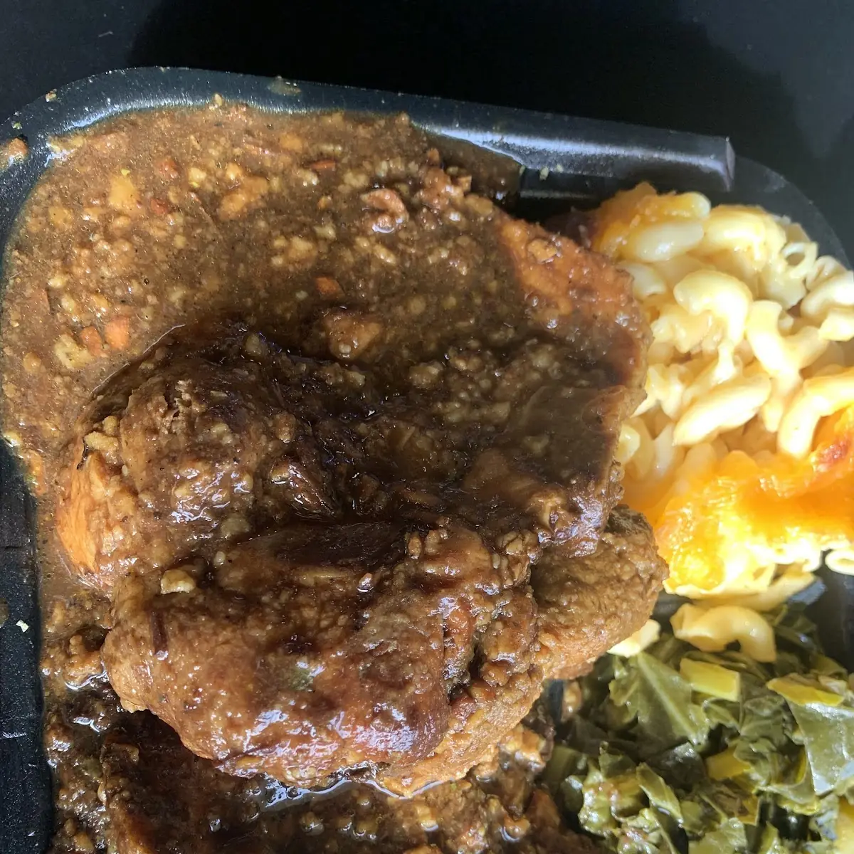 Smothered Pork Chops Collard Greens and Mac and Cheese