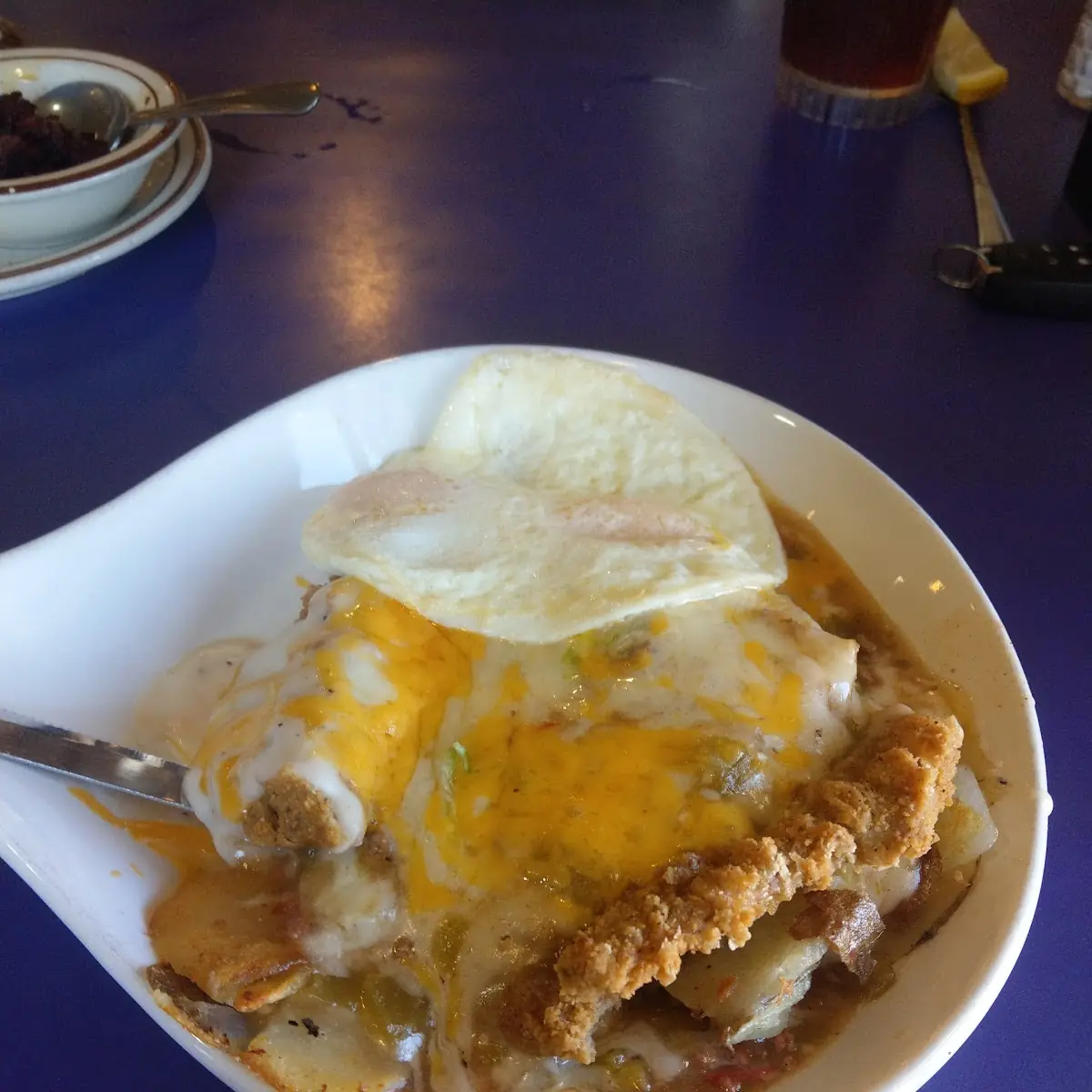 Chicken Fried Steak with Chile with 2 Eggs Cream Gravy Hash Browns and Toast