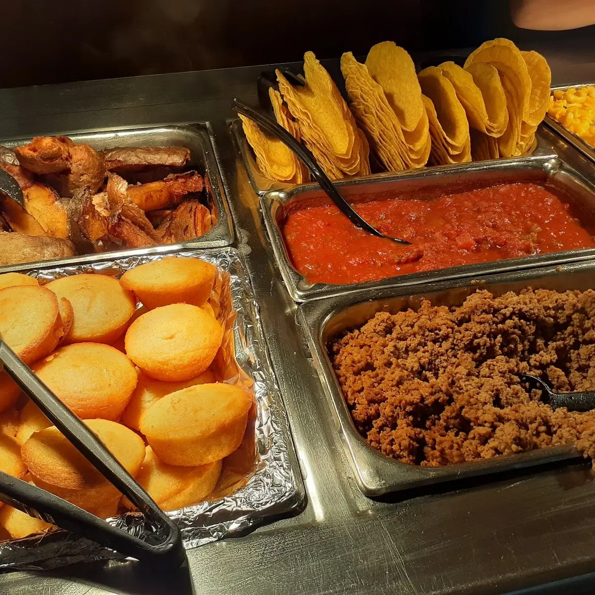 Tacos with Fixings Corn Muffins and Other Items from the Buffet