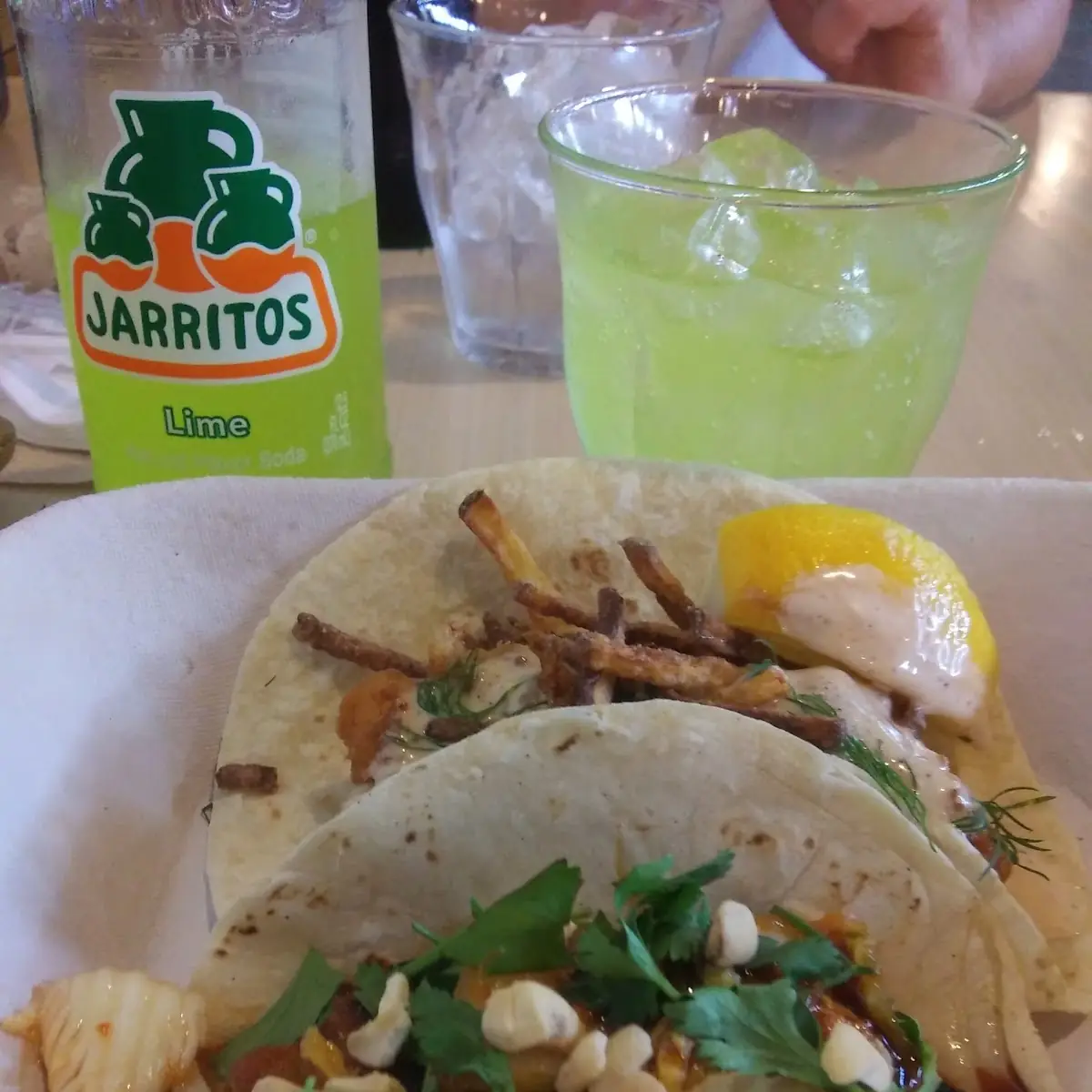 Front Korean Pork Belly Taco Back Taco Is Fish and Chips