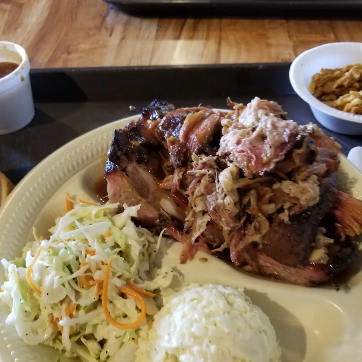 1 Large Baked Potato with Choice Chopped Brisket or Pulled Pork and a 16 Oz Drink