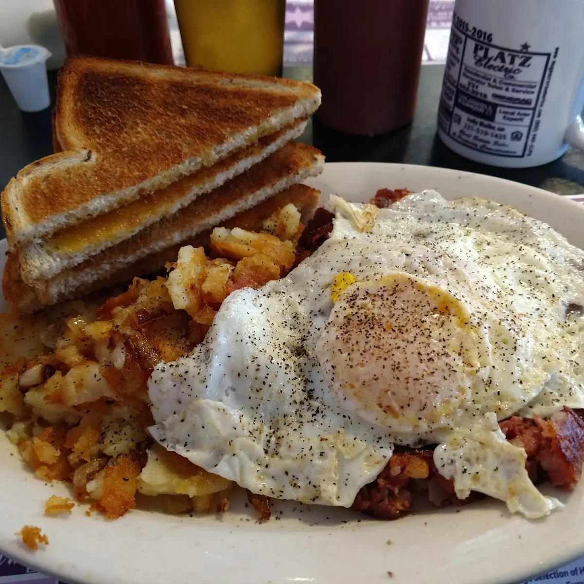 Corned Beef Hash Eggs Potatoes and Rye Toast