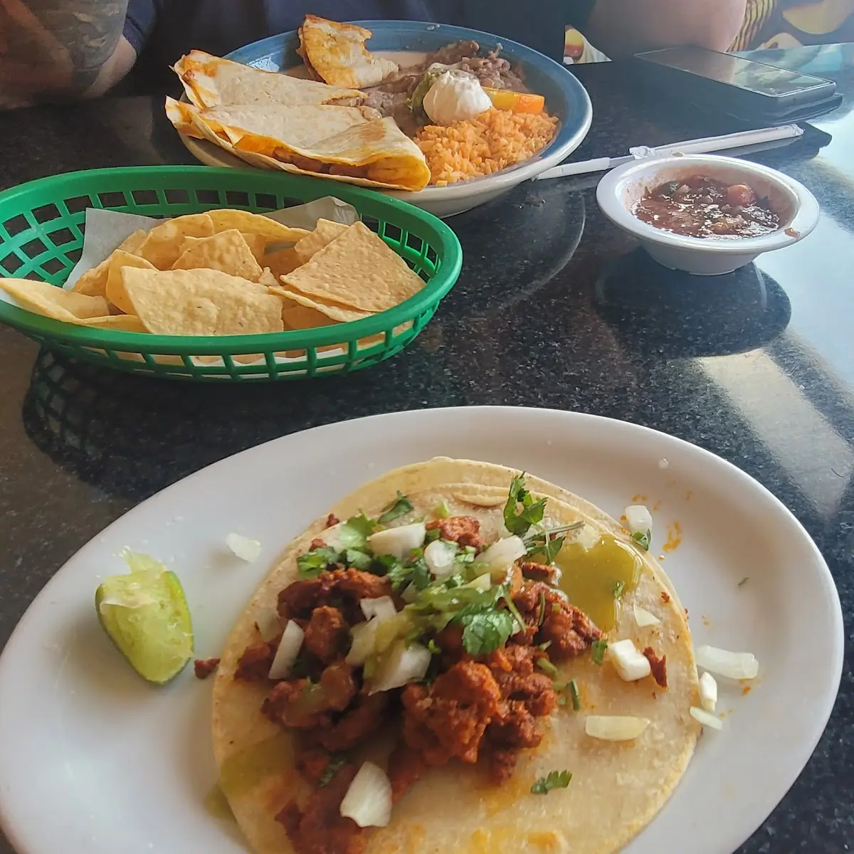 Chips Salsa Pastor Quesadilla and a Pastor Taco