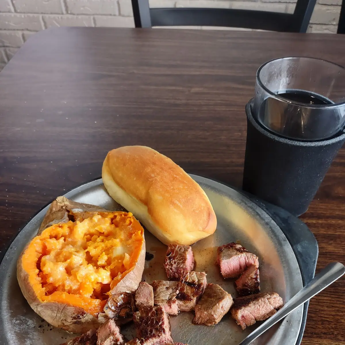 Steak Tips Baked Potato Peach Cobbler and Fresh Coffee