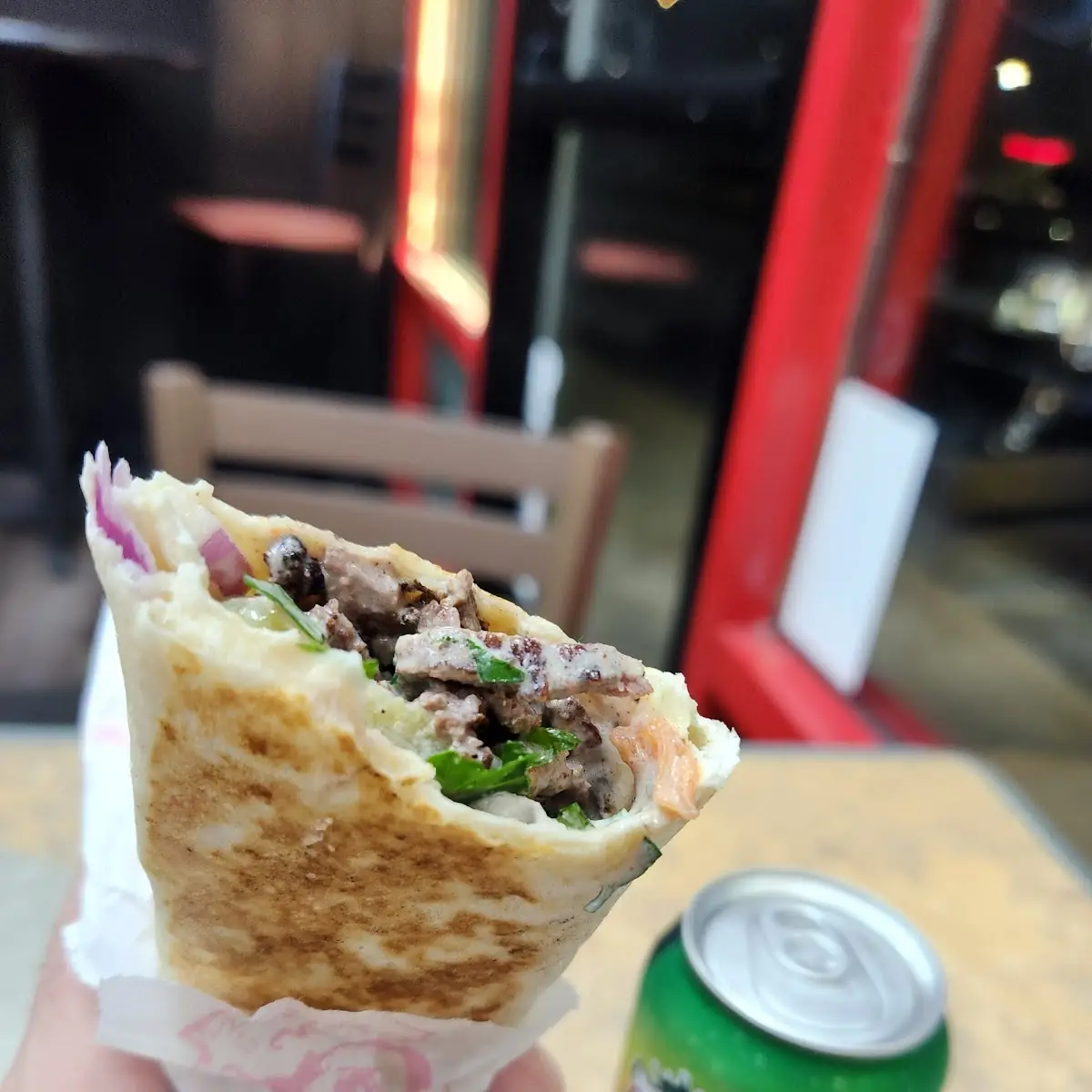 Beef shawarma over hummus