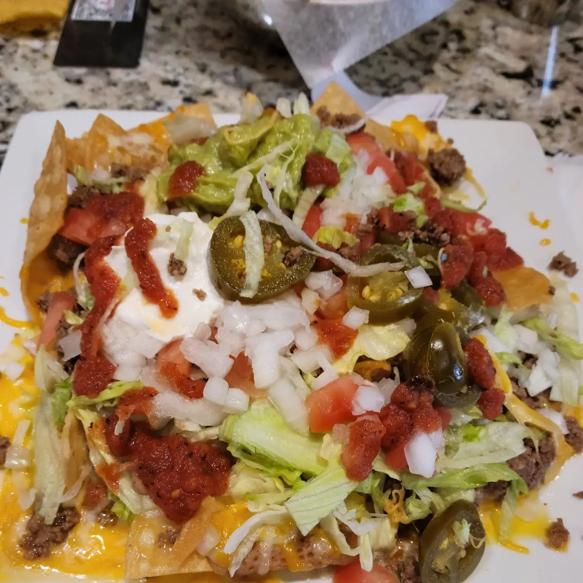 Cinco Cinco Nachos with Their Hot Sauce