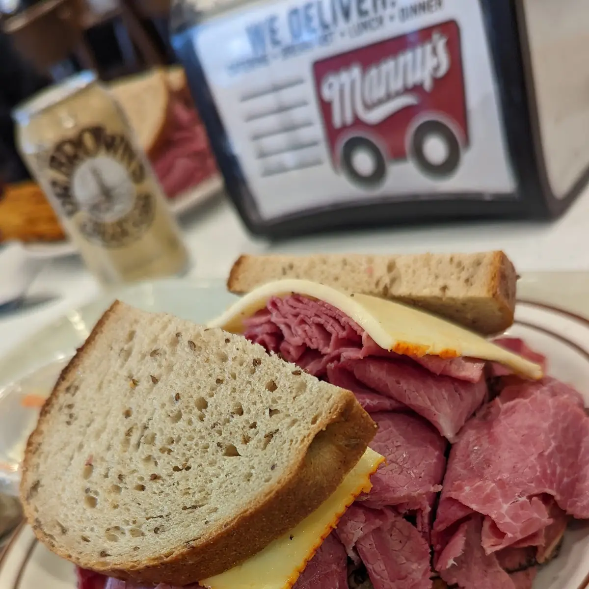 Corned Beef and Pastrami Sandwich on a Kaiser Roll