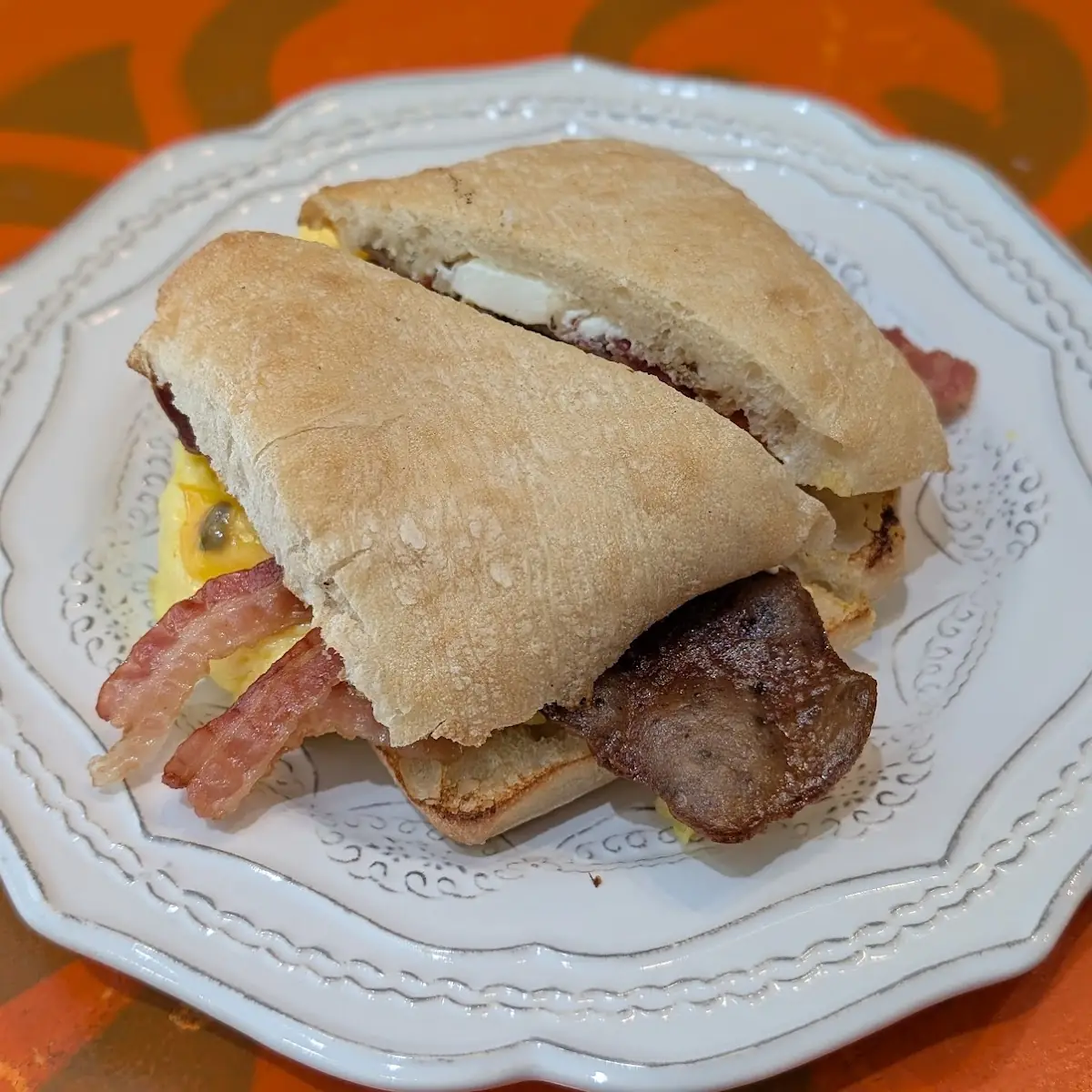 Chanel Lamb Sausage Bacon Cream Cheese Eggs Cheddar on Ciabatta