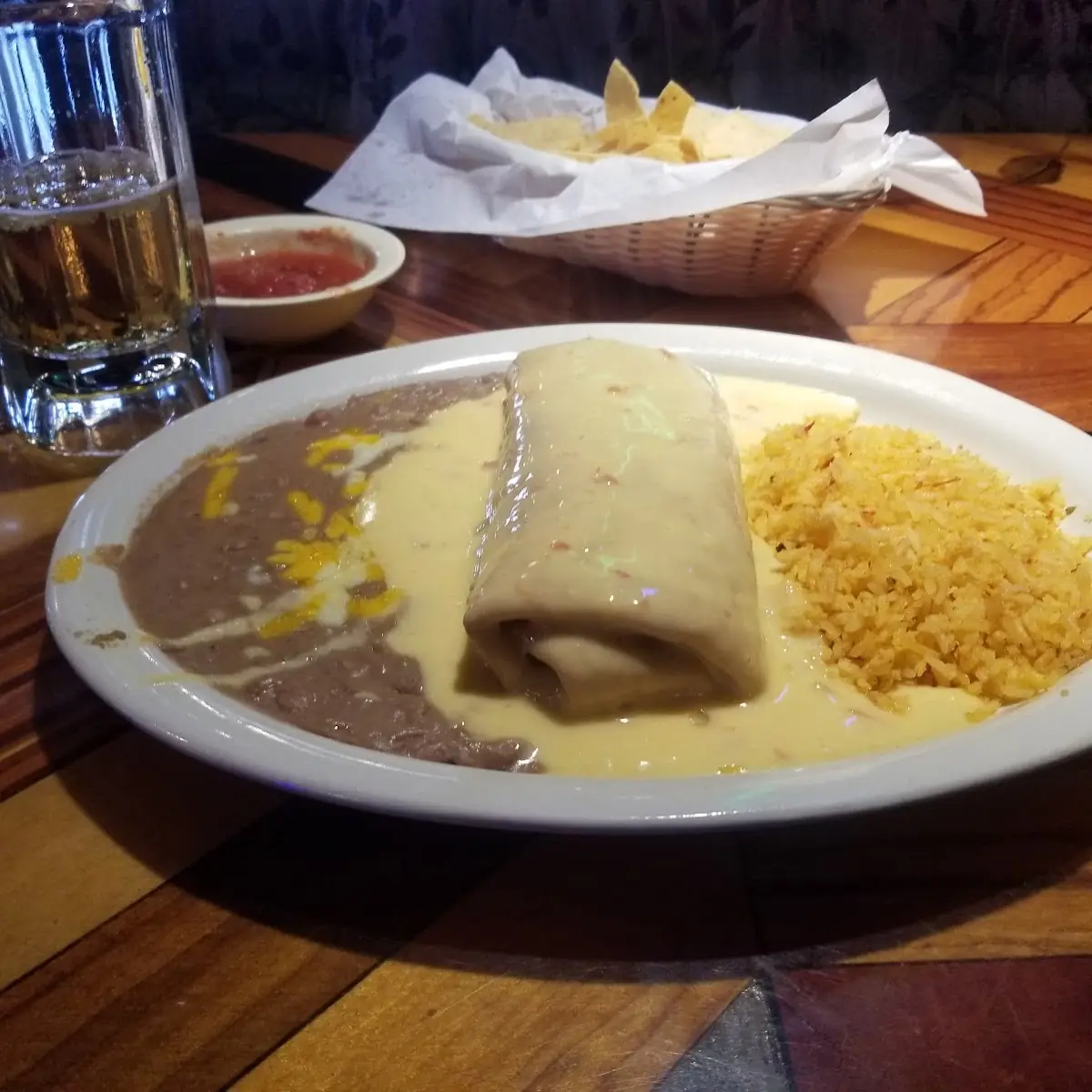 One Beef Burrito Covered with Queso And