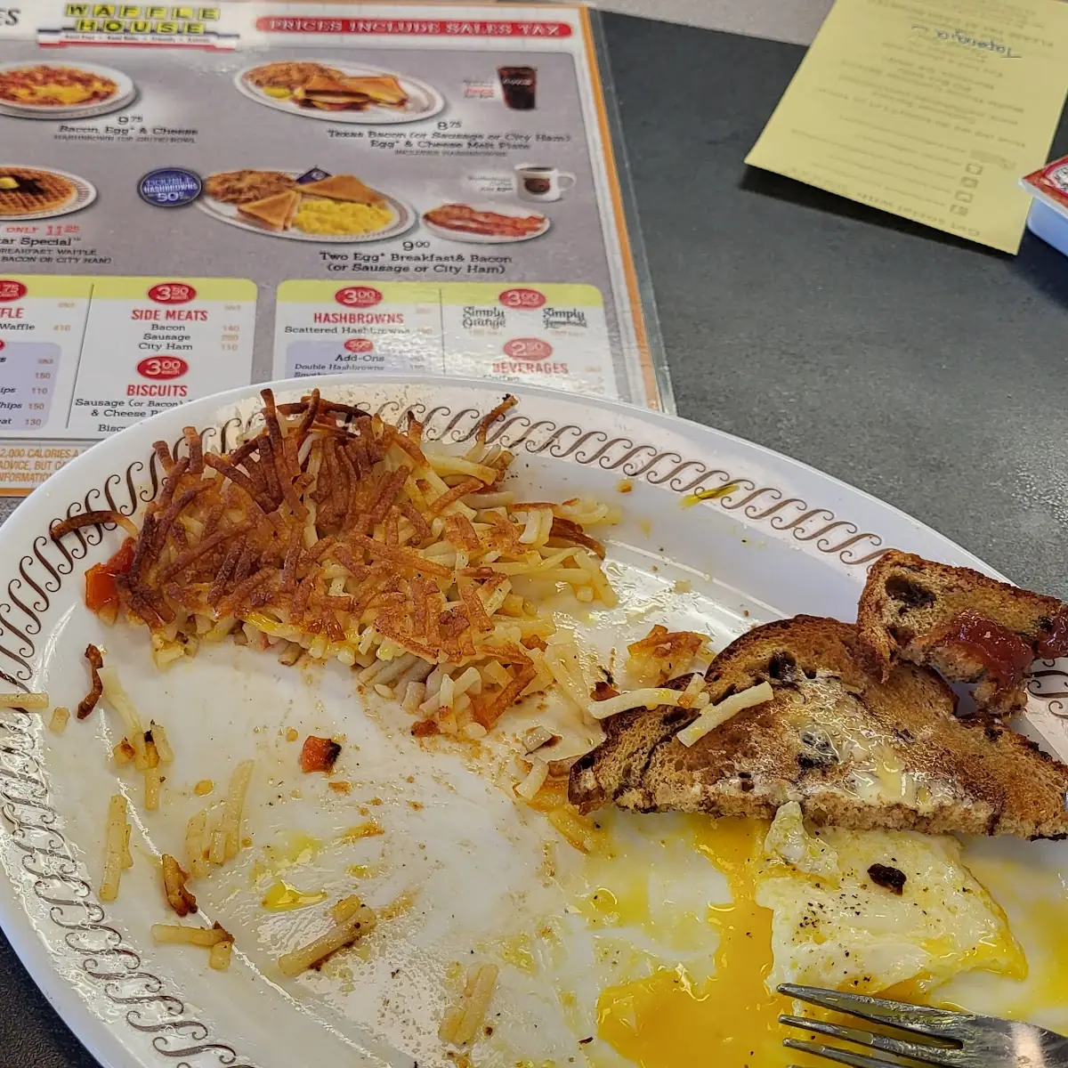 2 Fried Eggs Crispy Hash Browns & Raisin Toast