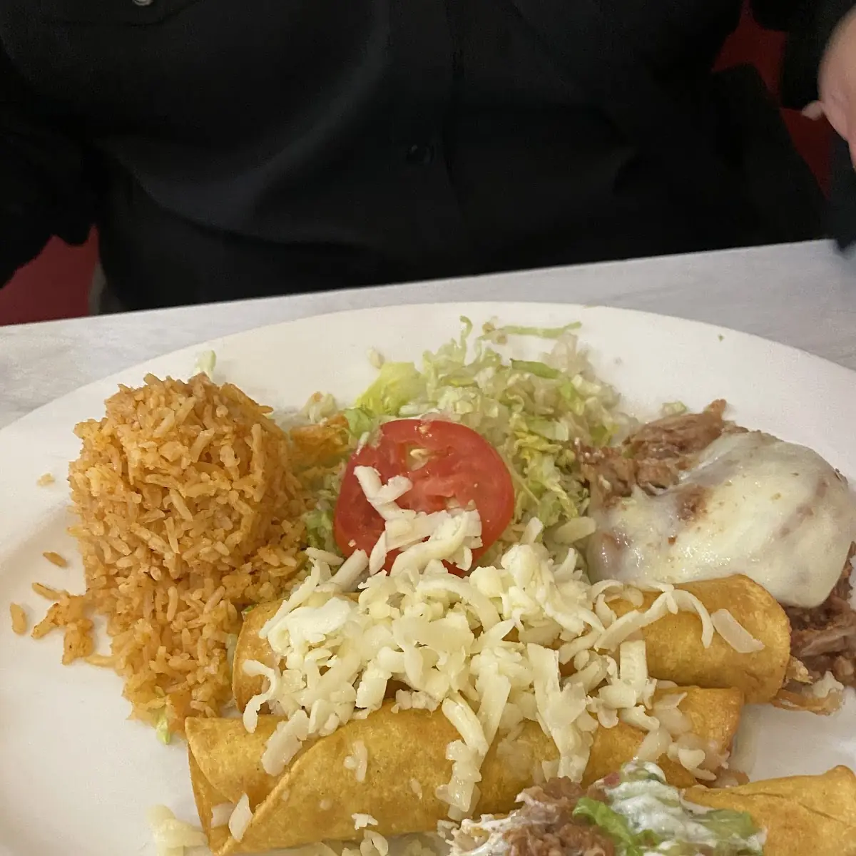 Chicken Rolled Tacos with Rice and Beans