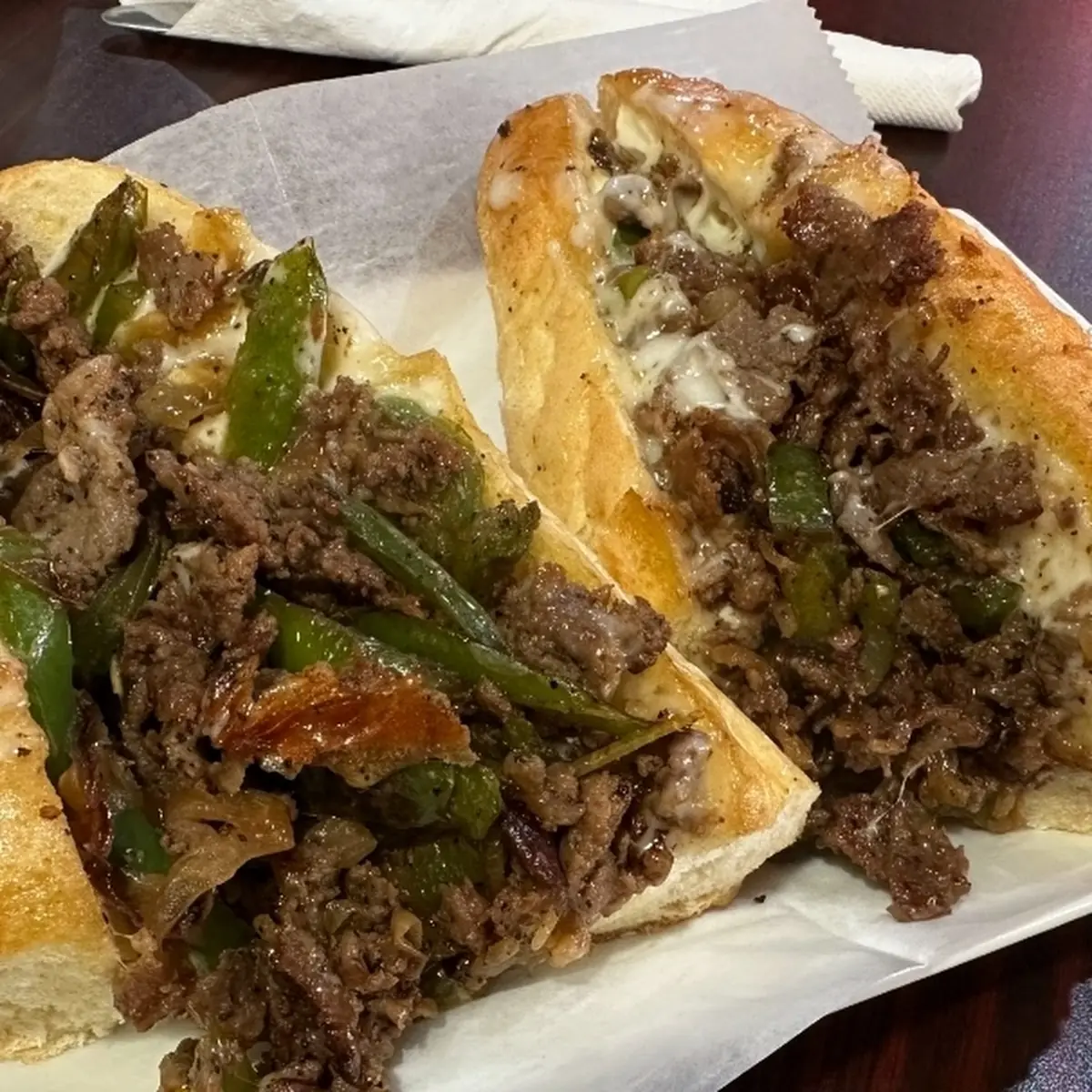 Philly cheesesteak pizza sandwich
