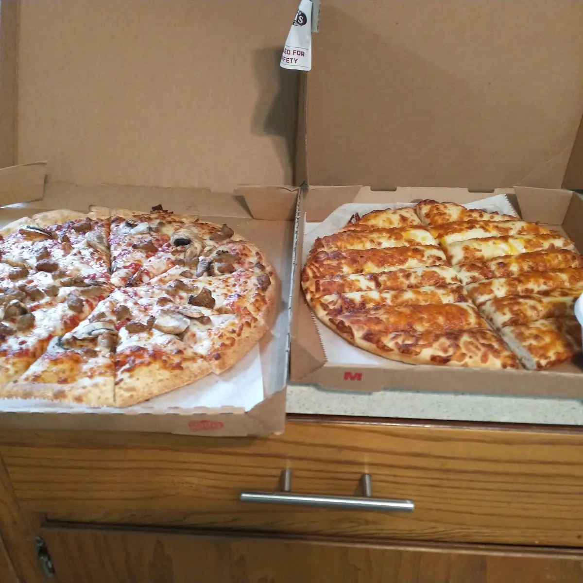 Large Italian Sausage Pizza and Medium Cheese Sticks