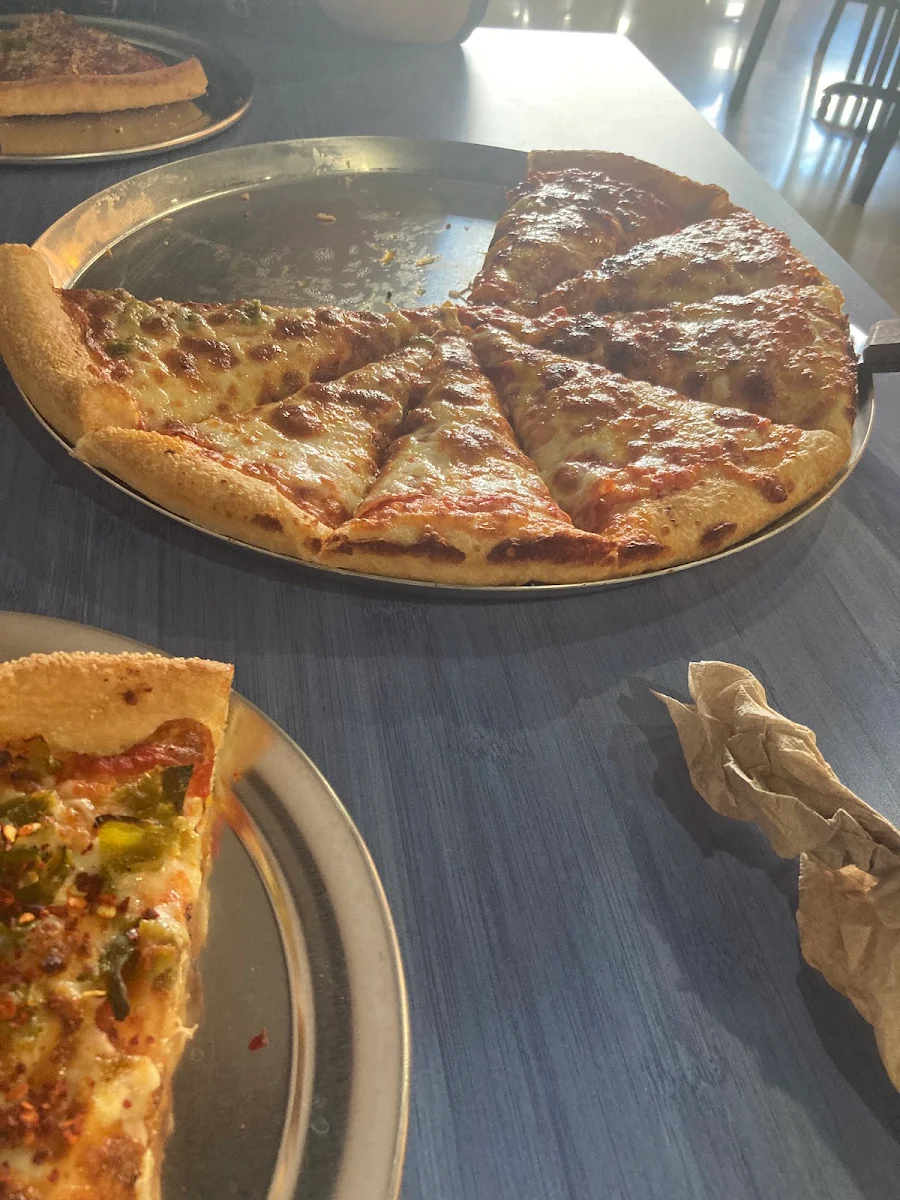 Cheese Pizza and Pepperoni and Green Chile Pizza