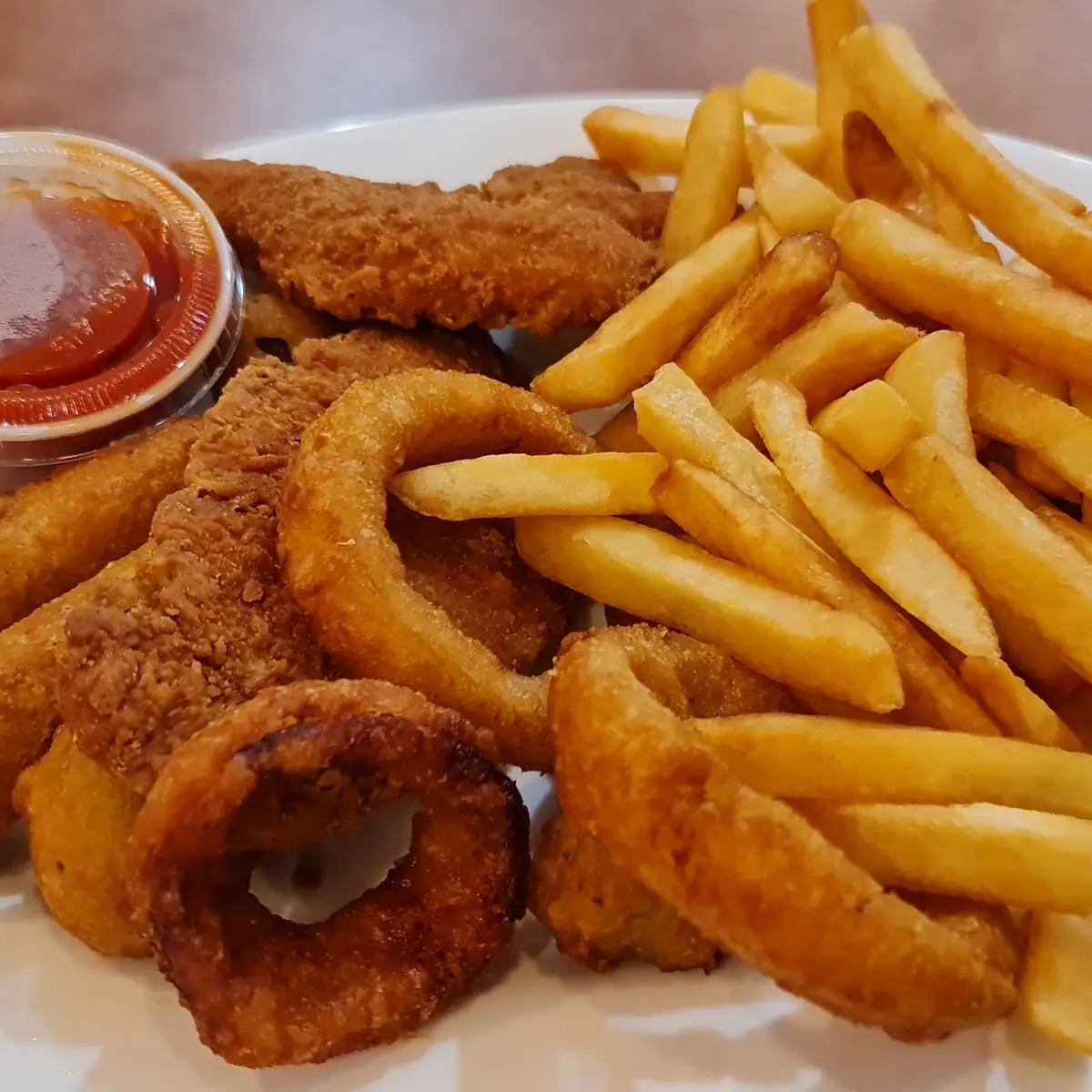 Sampler Platter with Fries Onion Rings Mozzarella Sticks and Fried Mushrooms