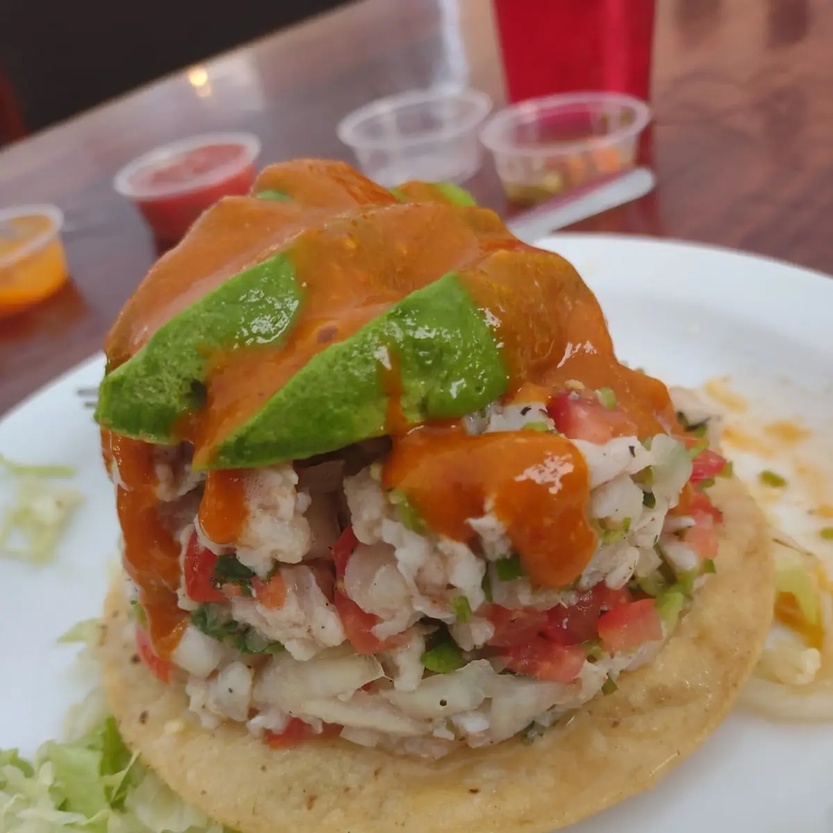 Ceviche Tostada Topped with Avocado and Salsa