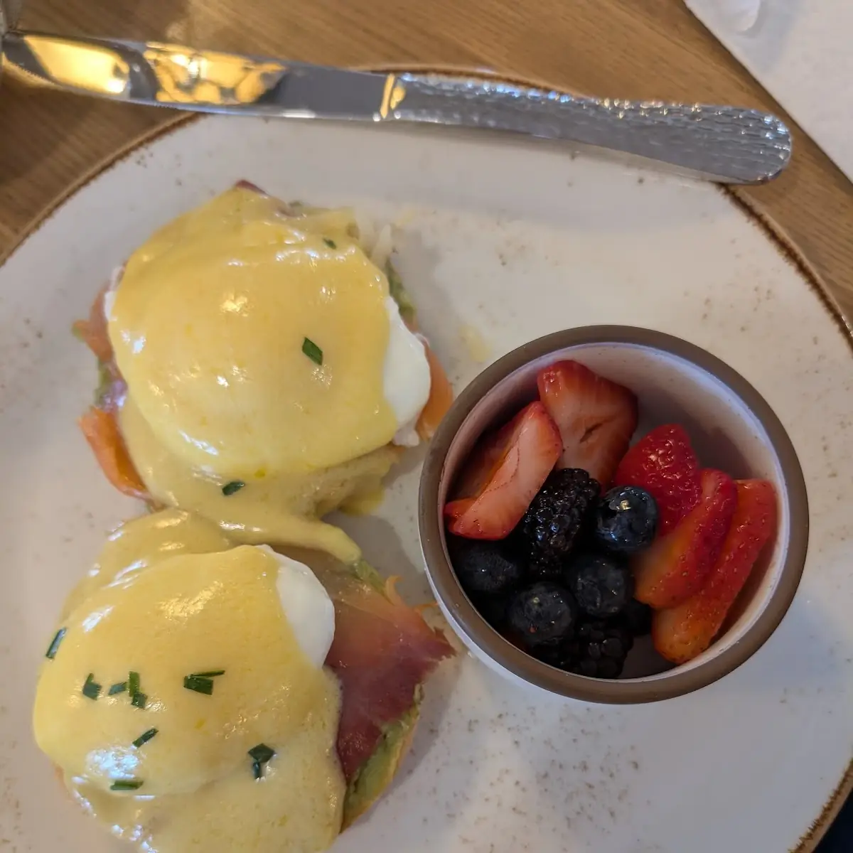 Eggs Benedict and Fruit Bowl