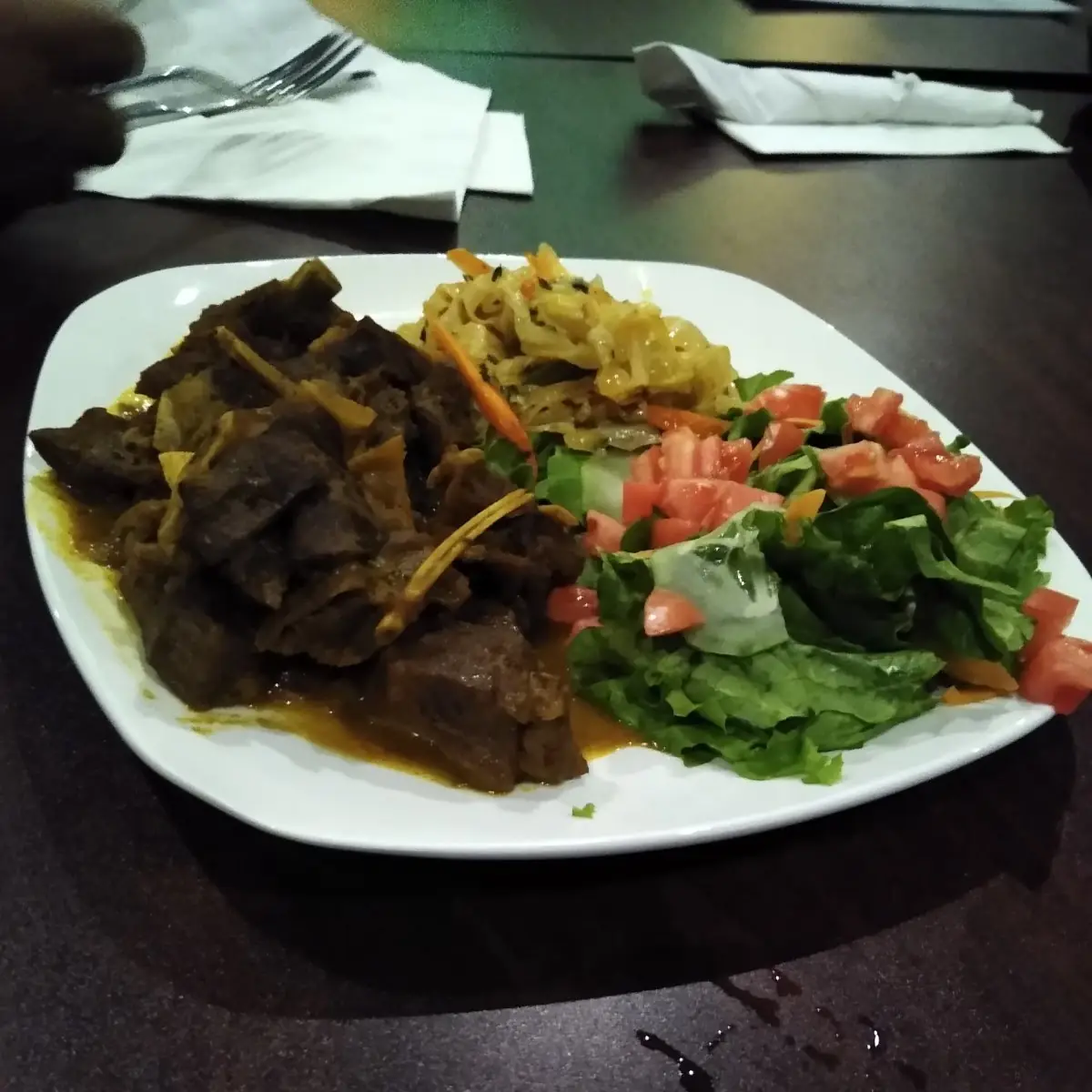 Curry Goat Steamed Cabbage and Salad