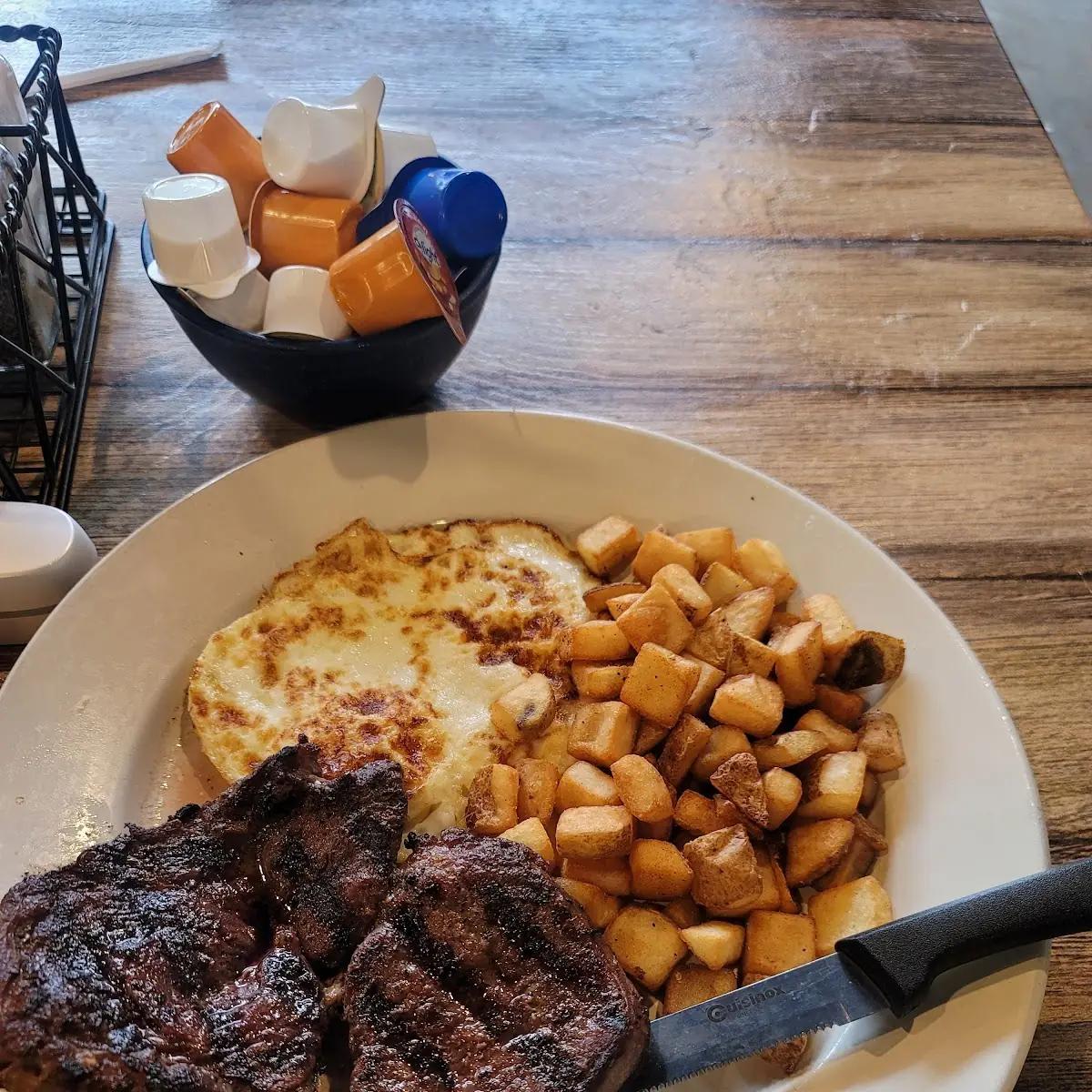 Ribeye Steak and Eggs Fried Hard with Hash Browns