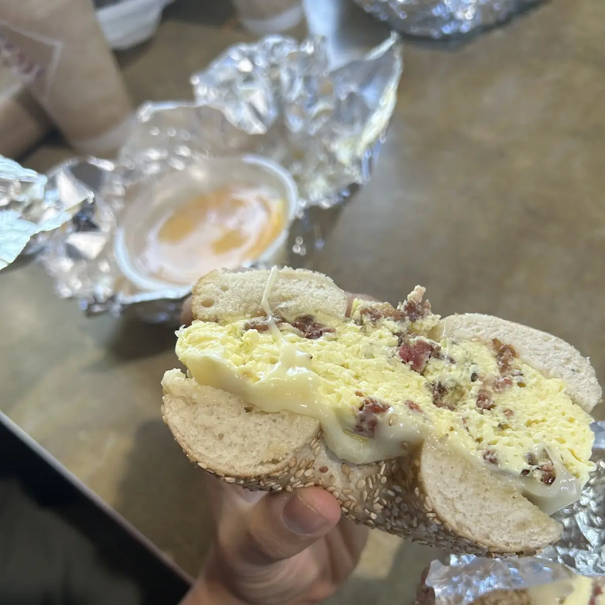 Sesame Bagel with Eggs and Sausage