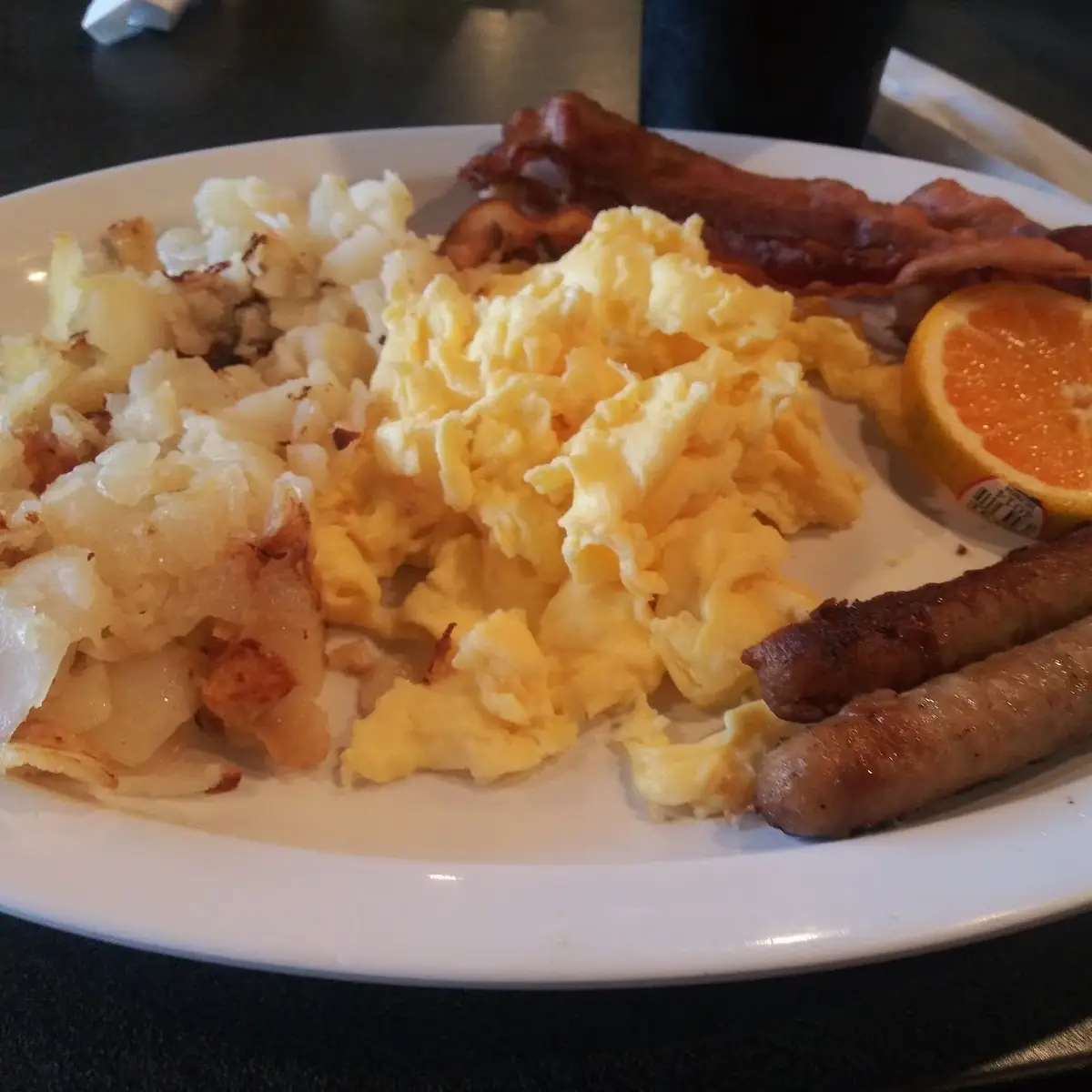 Eggs Sausage Hash Brown Bacon & Oranges