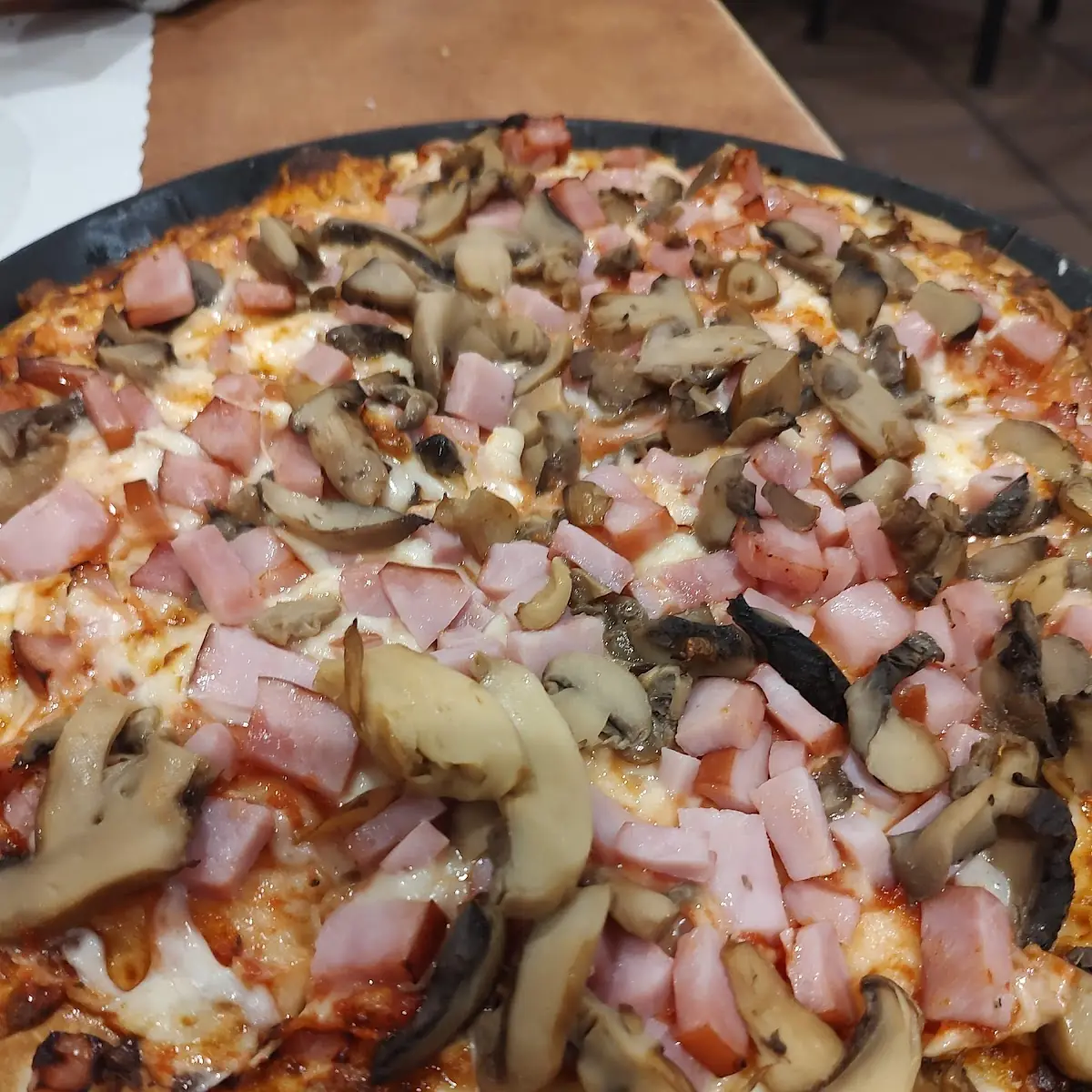 Ham and Mushroom Pizza with Extra Sauce
