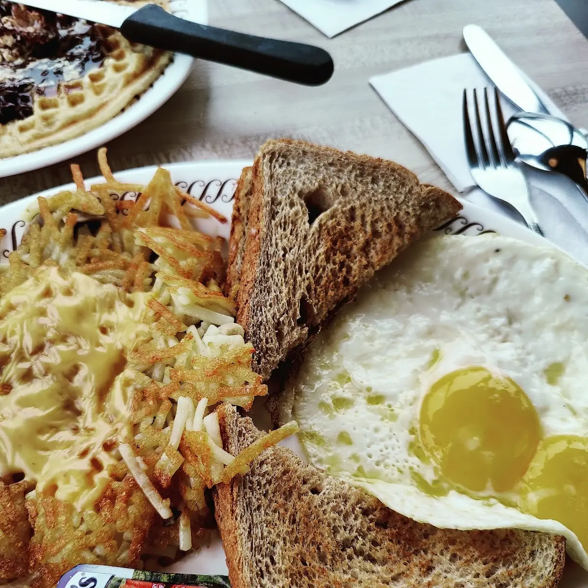 Hash Brown Eggs Sunny Side Up with a Steak