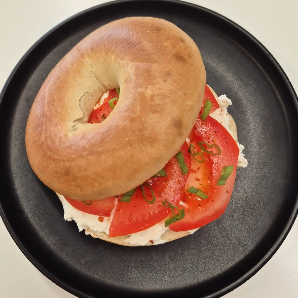 Bagel with Cream Cheese Tomatoes & Spring Onions