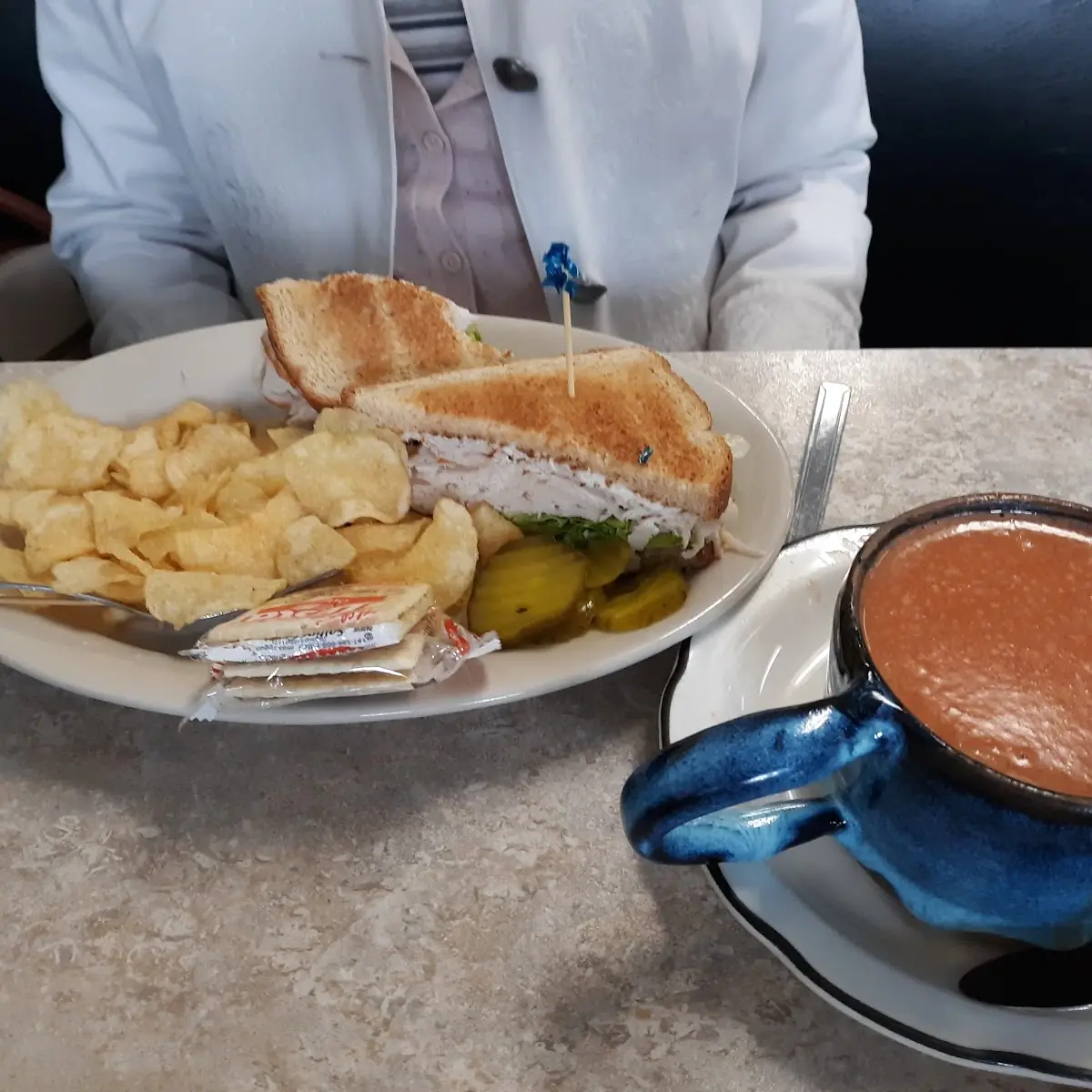 Turkey Sandwich with Chips and Tomato Soup