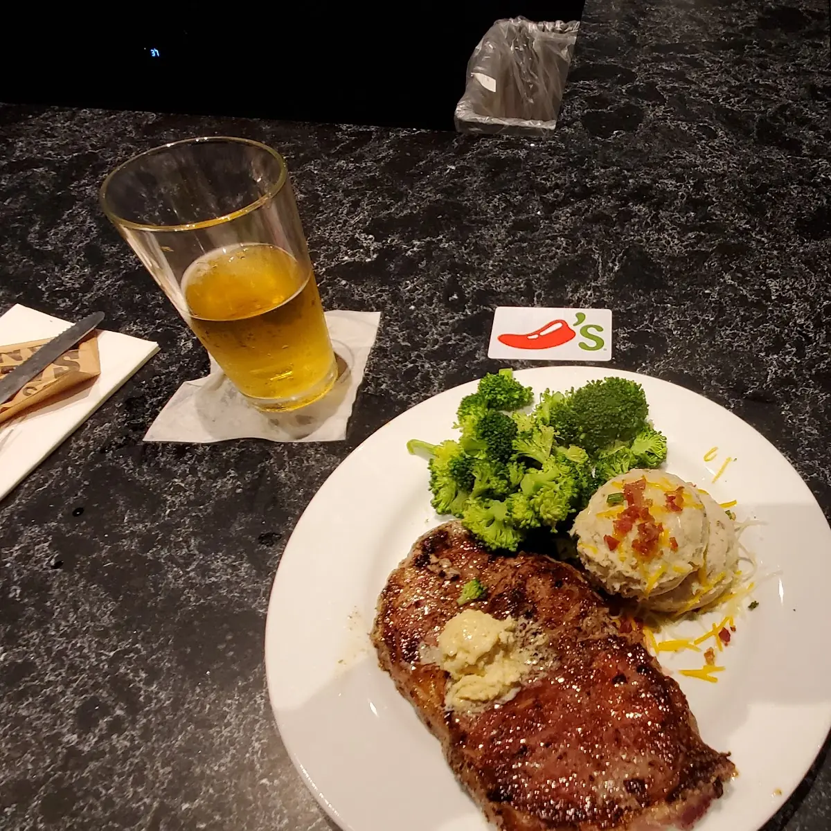 Ribeye Steak with Smashed Potatoes and Steamed Broccoli