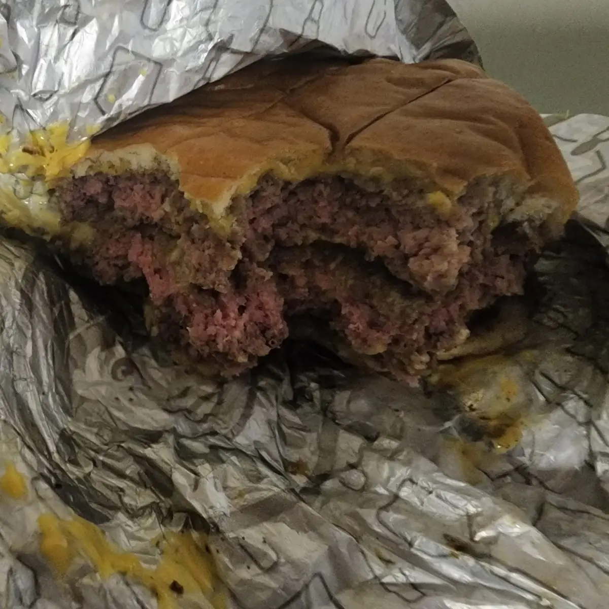 Undercooked Triple Cheeseburger