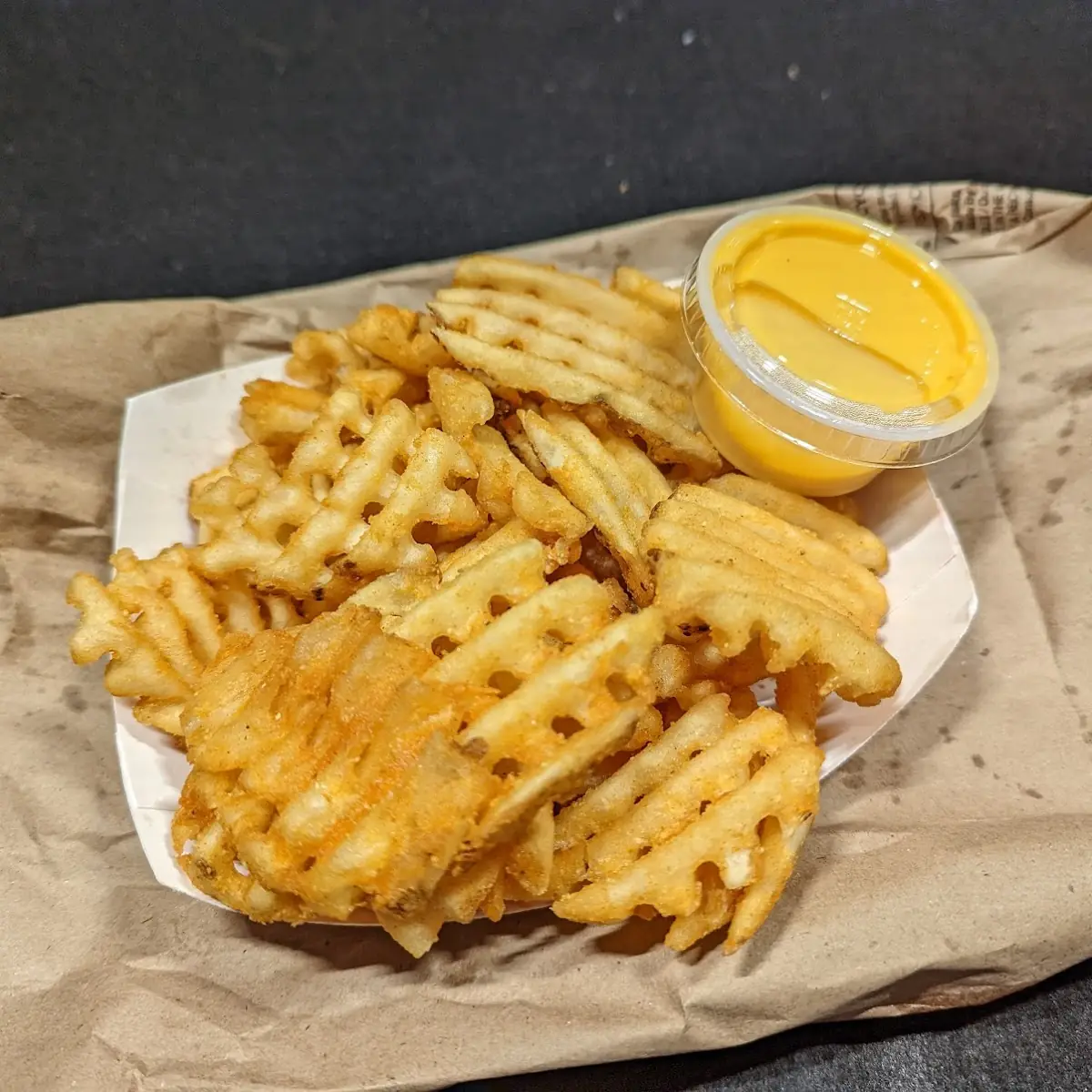Waffle Fries with Cheese Sauce