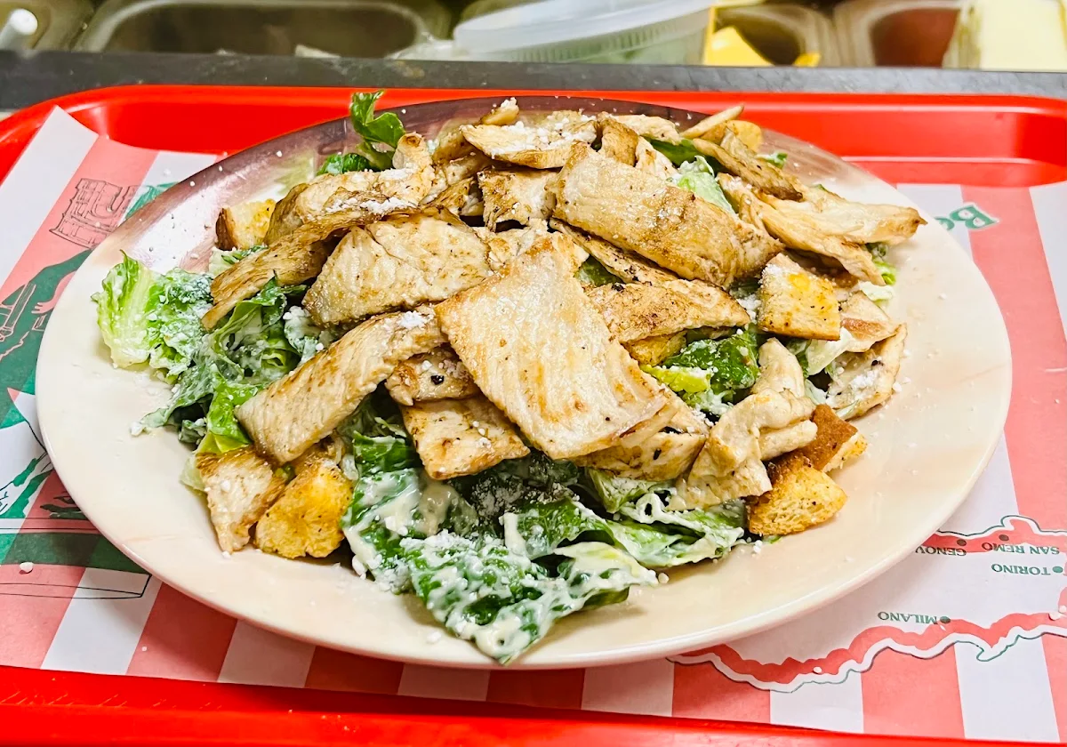 Chicken Cutlet over Caesar Salad