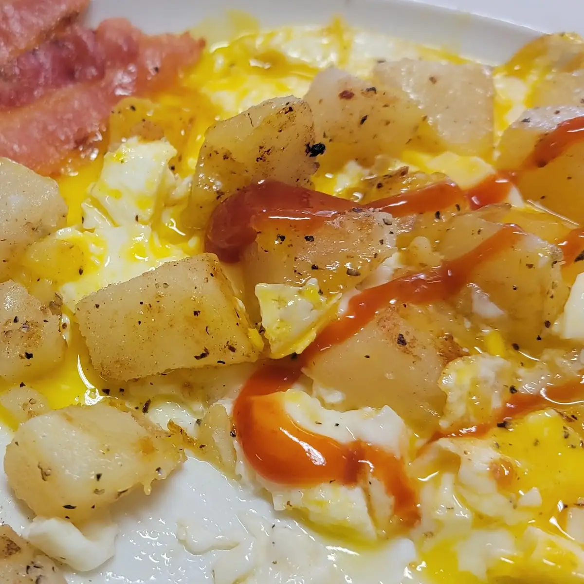 Two Eggs over Easy Bacon Potatoes & Toast