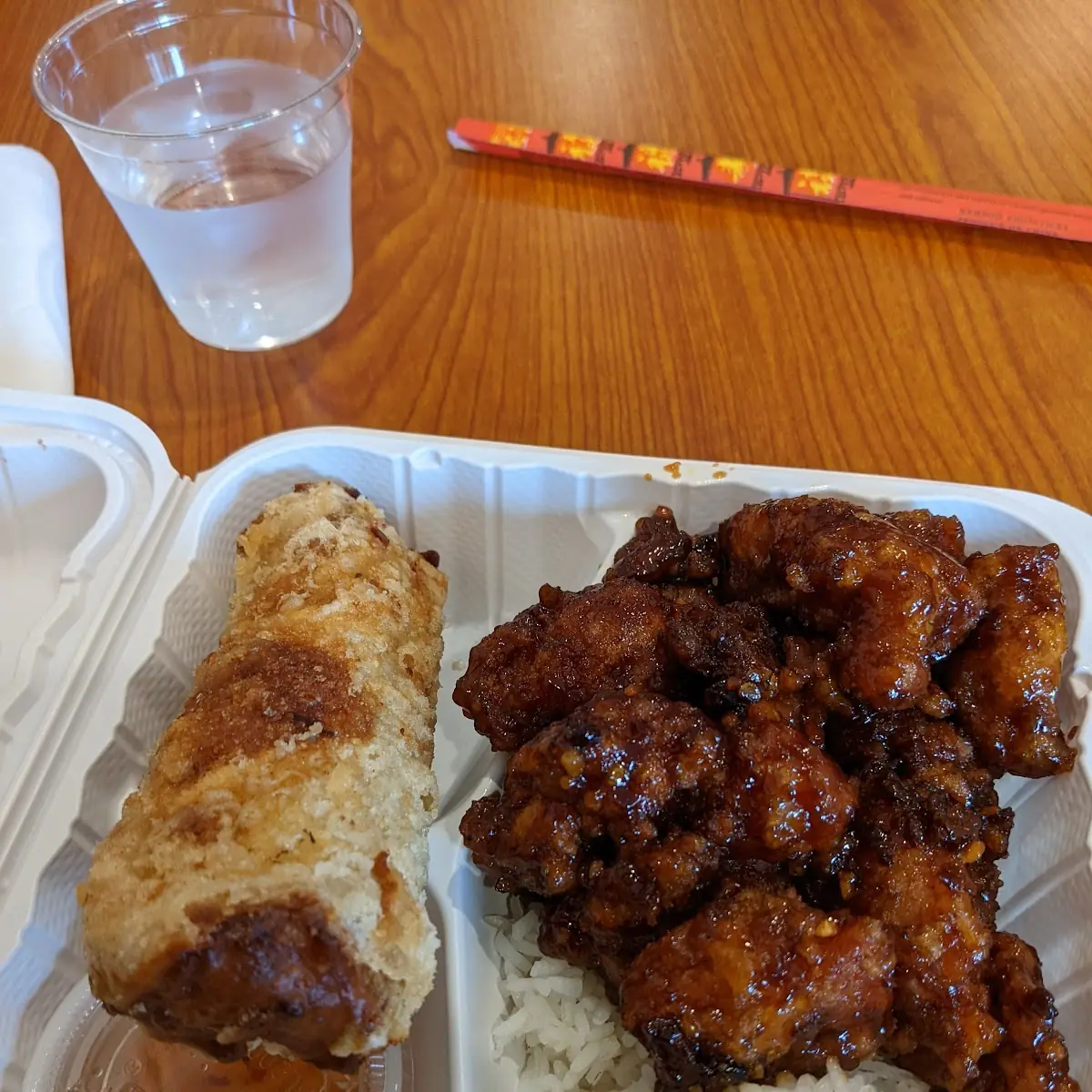 Spicy Orange Chicken with Egg Roll and Steamed Rice