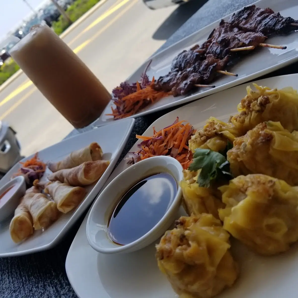 Moo Ping Ka Nom Jeeb Crispy Shrimp Rolls and a Thai Iced Tea