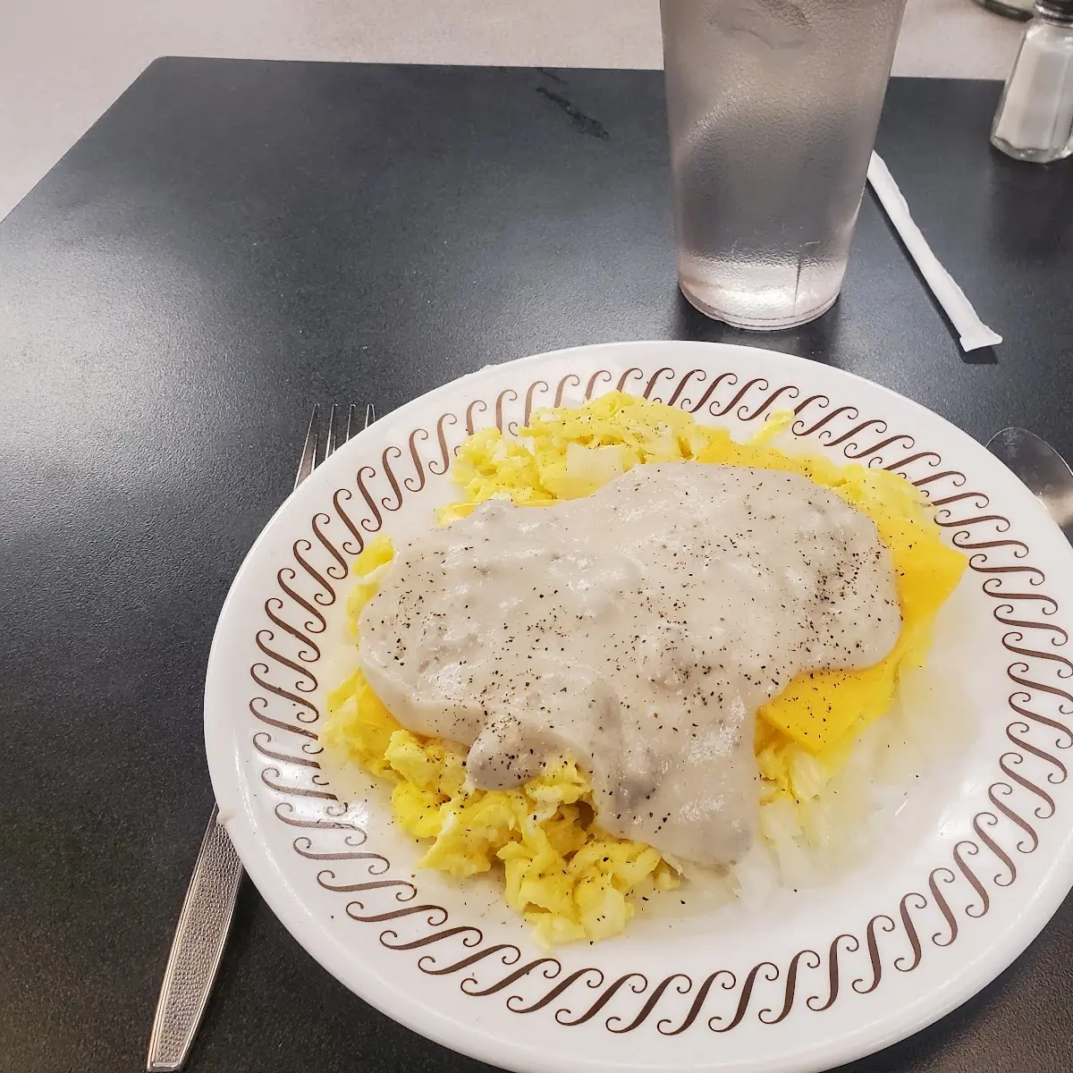 Scrambled Eggs with Sausage Gravy Cheese and Onions