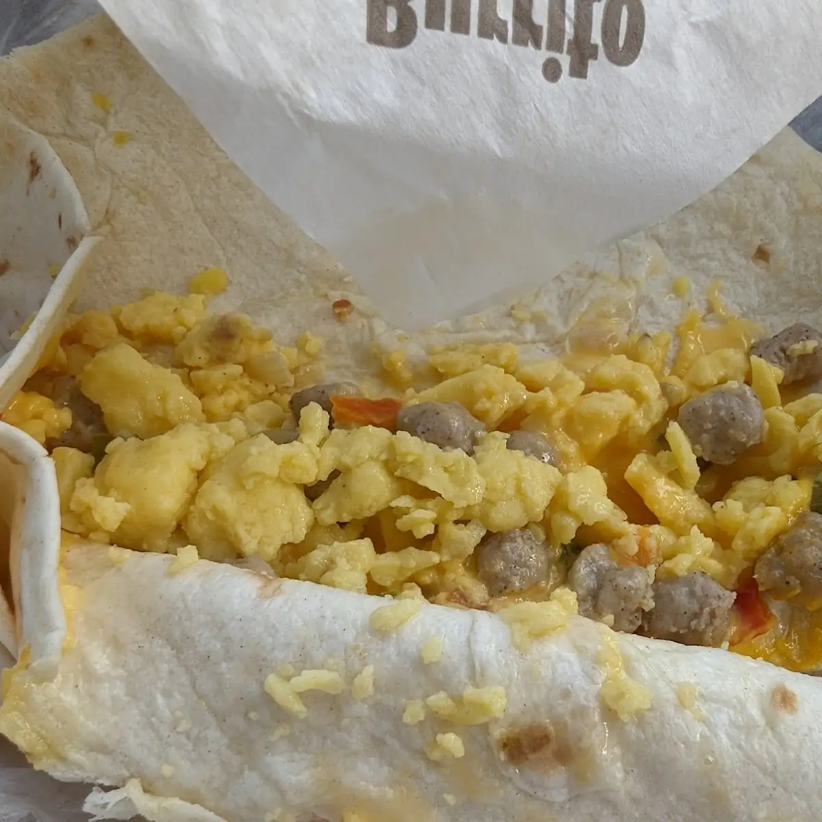 Breakfast Burrito with a Black Hair Inside Far Right