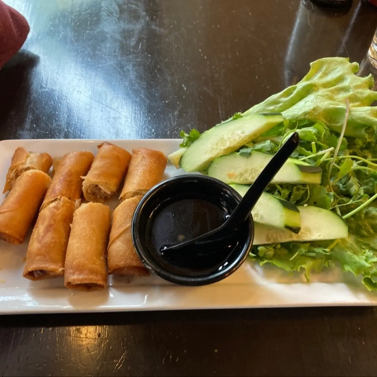 Grilled Pork & Crispy Spring Rolls on Rice Noodles