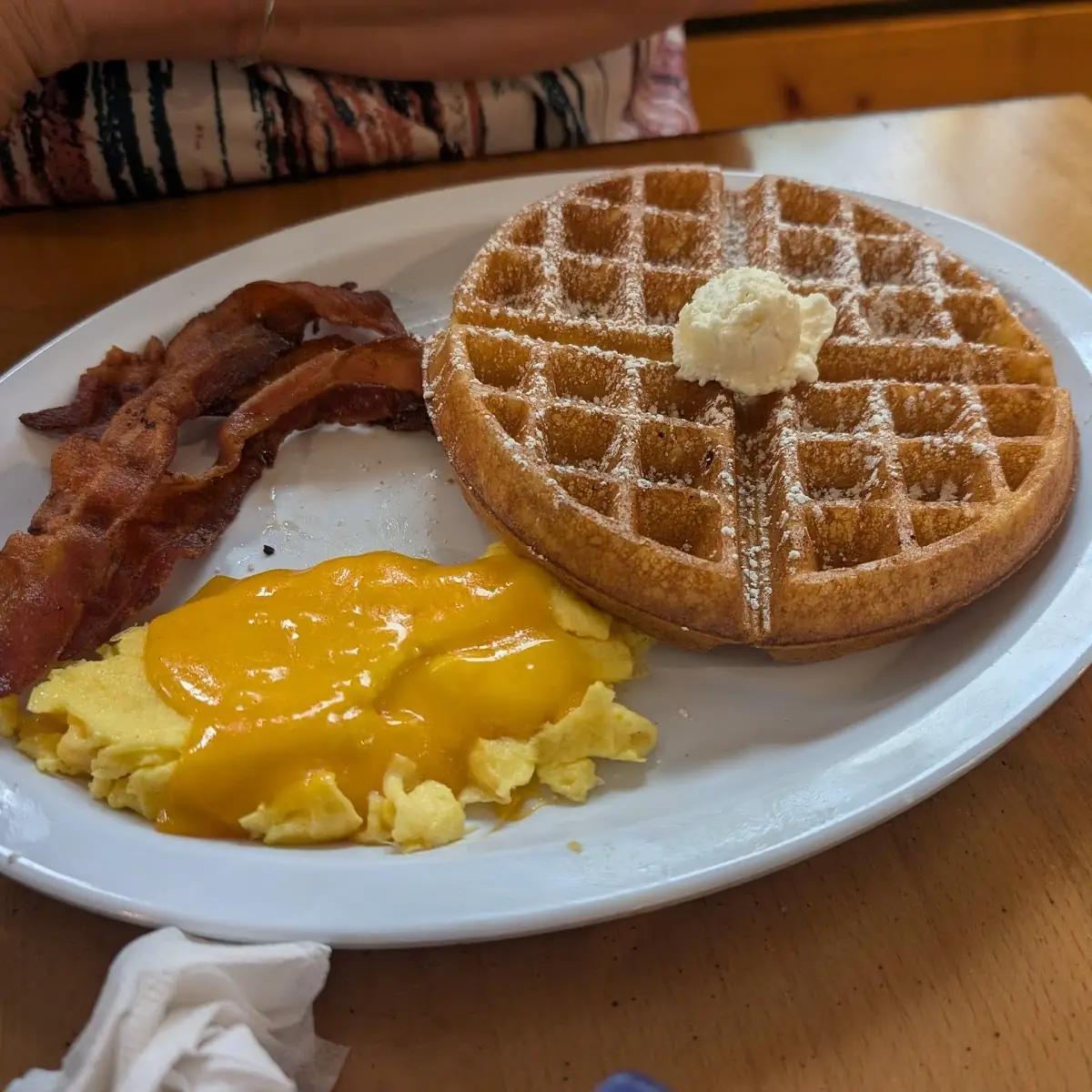 Red Velvet Waffle Eggs over Medium and Bacon