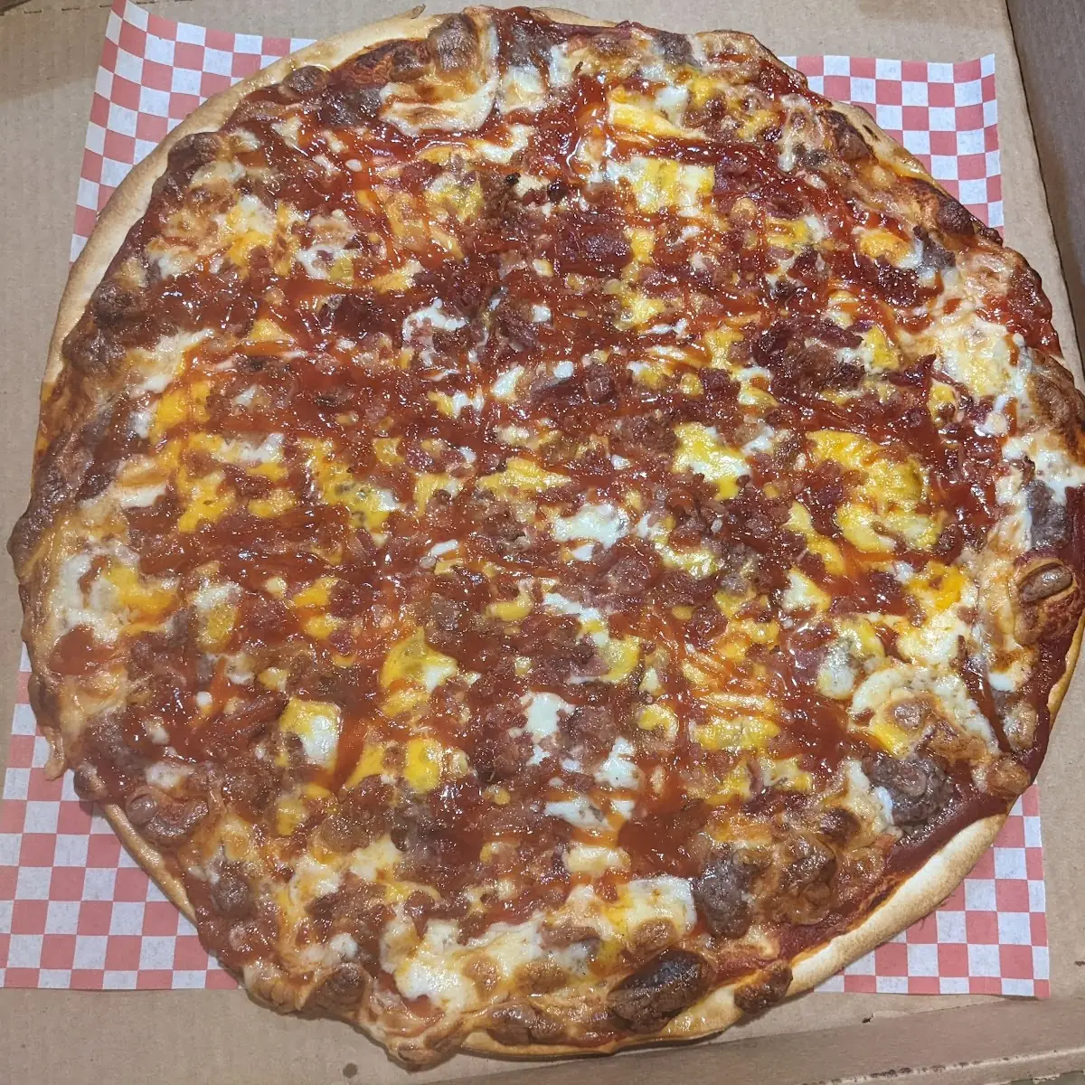 Bacon Cheeseburger Pizza with BBQ Sauce on Top