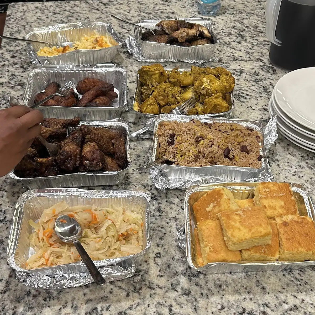 Cornbread Cabbage Rice and Beans Jerk Chicken Jerk Wings Plantains Curry Chicken and Mac&Che